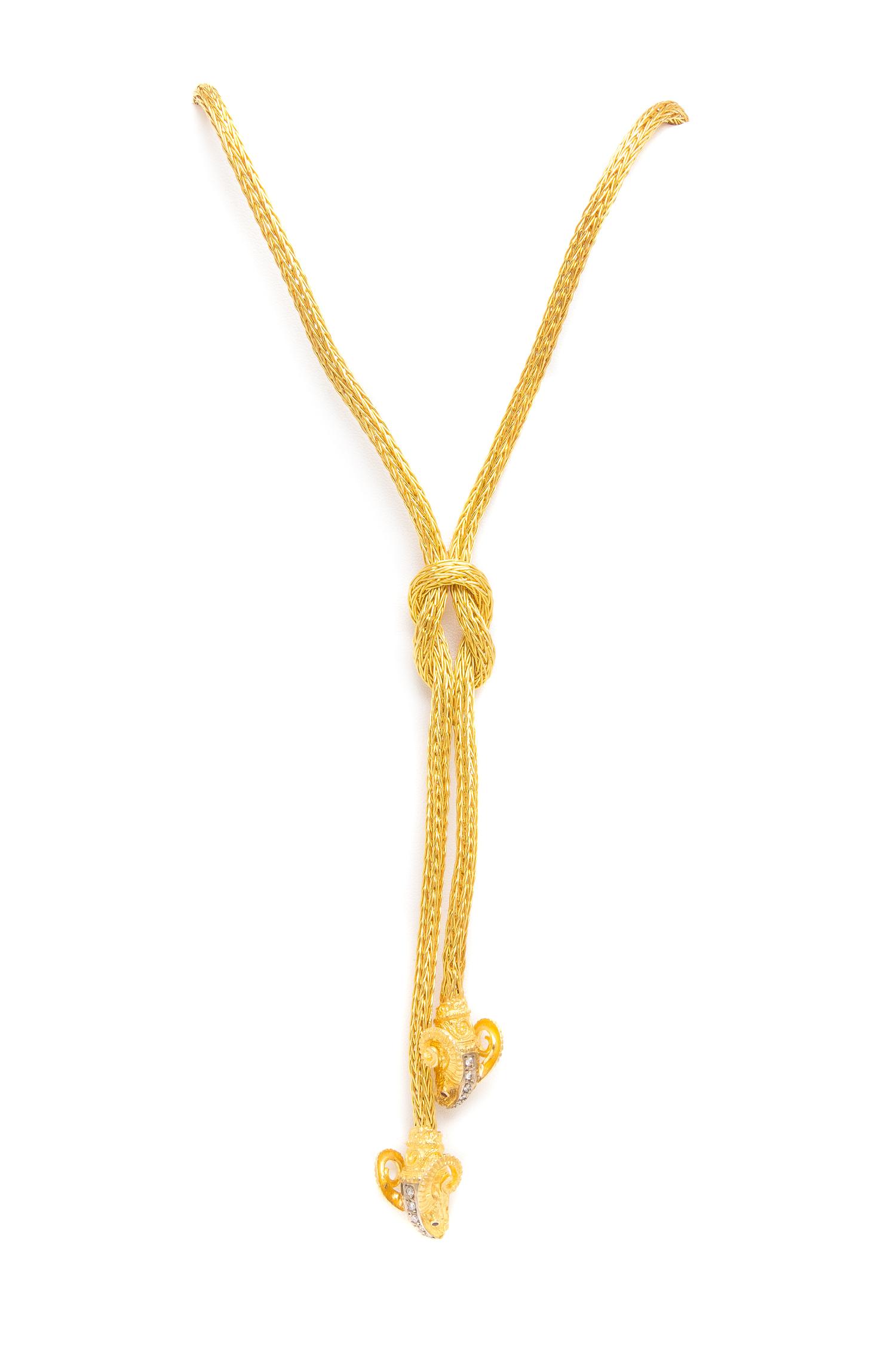 An 18 Karat Yellow Gold, Diamond and Ruby Ram's Head Demi Parure, 65.65 dwts.