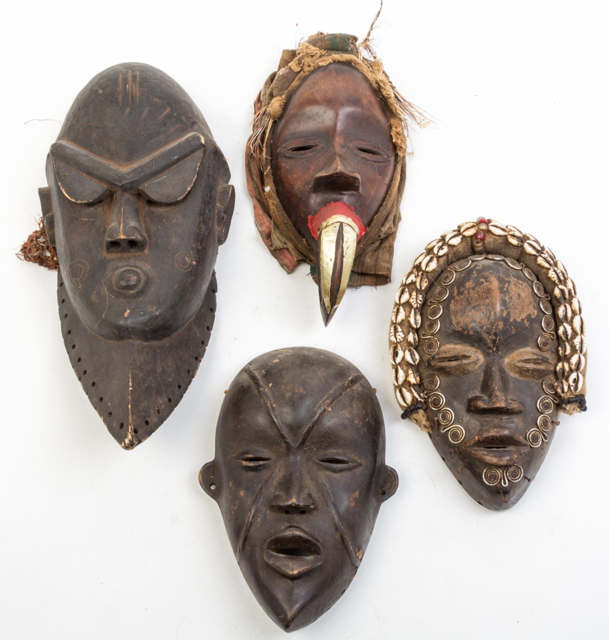 A Group of Six Masks Height of tallest 16 inches.
