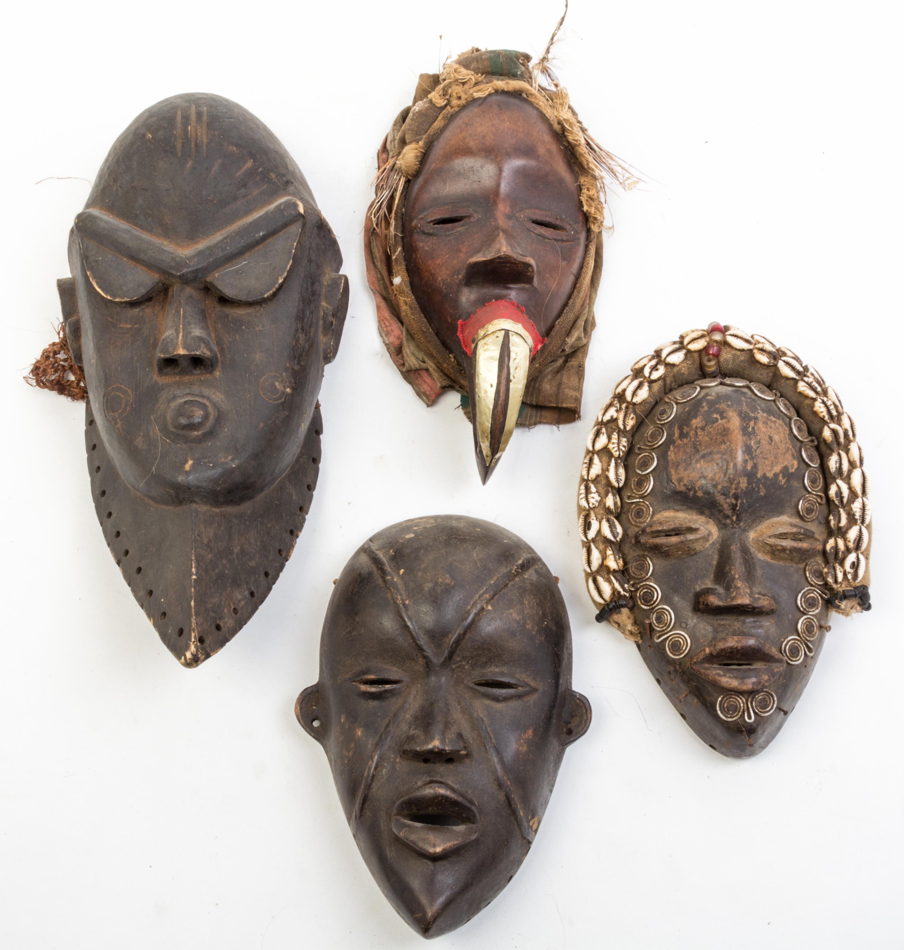 A Group of Six Masks Height of tallest 16 inches.
