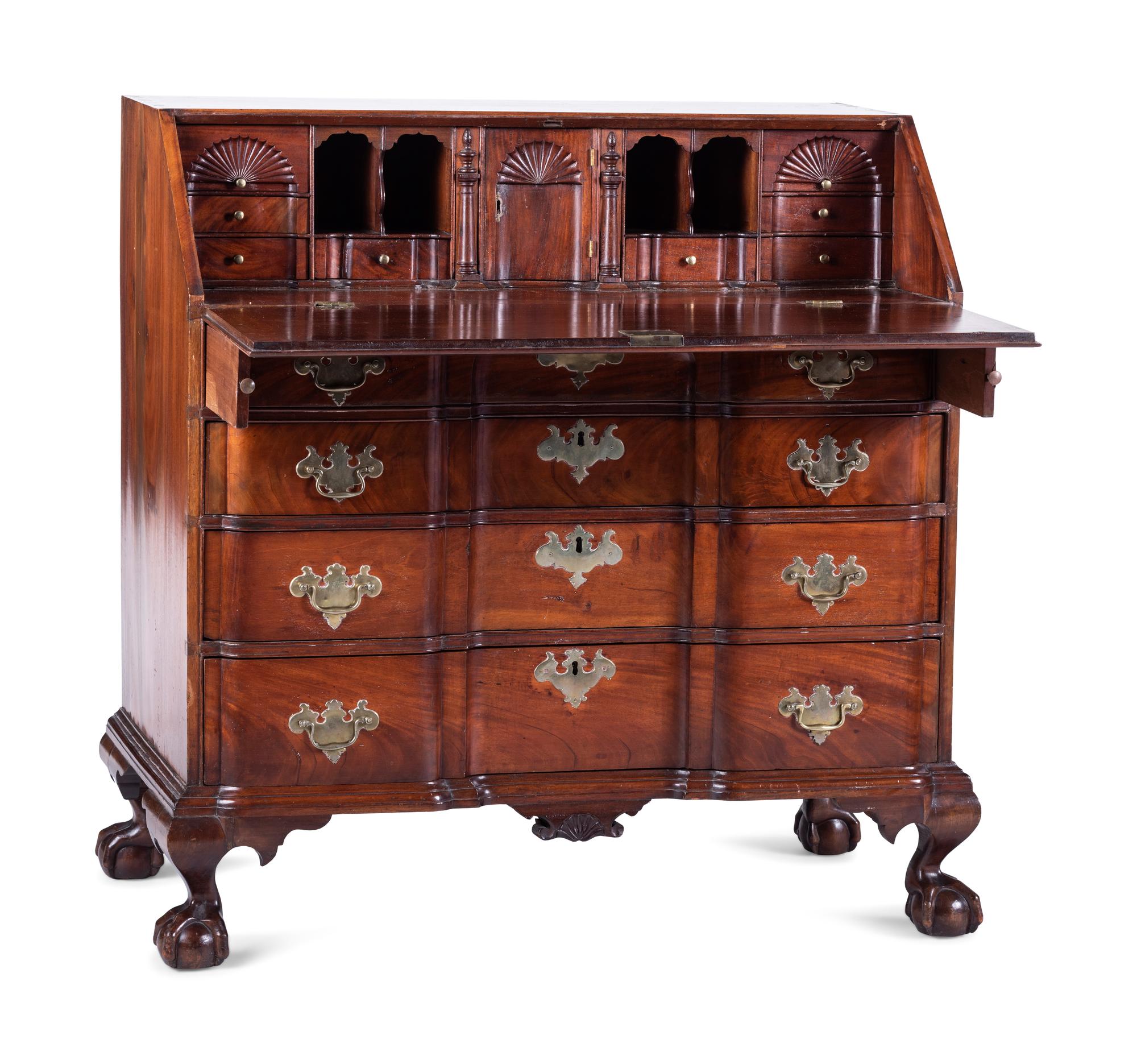 A Chippendale Carved and Figured Mahogany Block-Front Slant-Front Desk