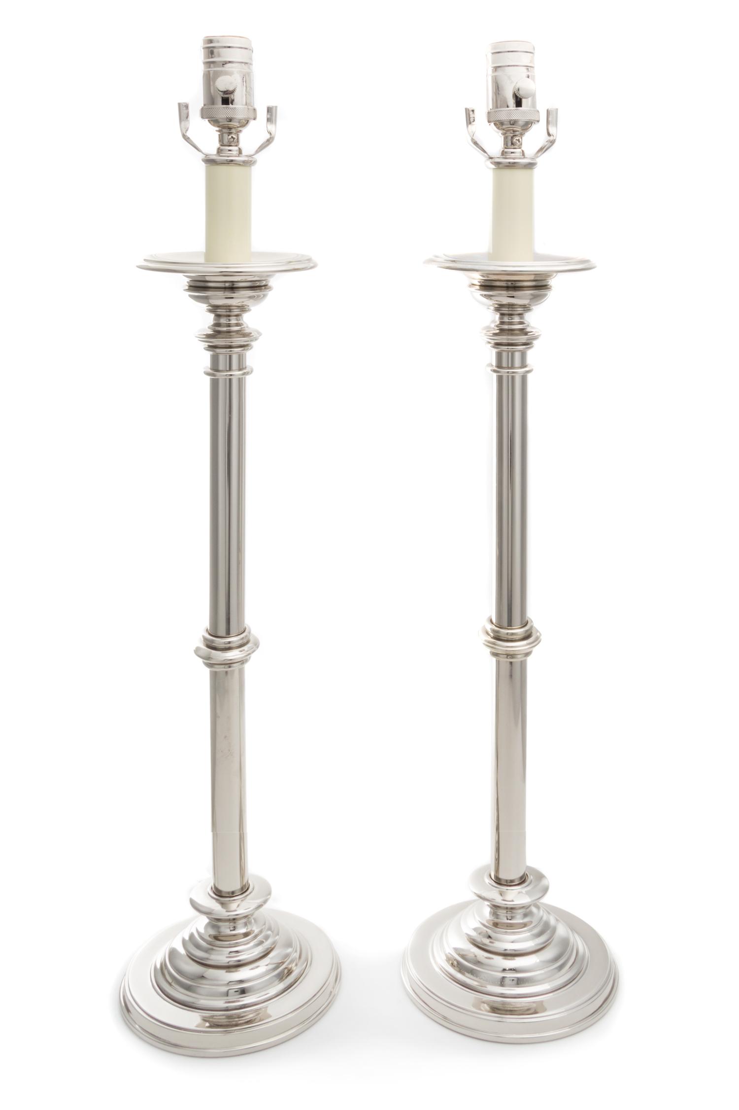 A Pair of Polished Metal Table Lamps Height 28 1/4 inches.
