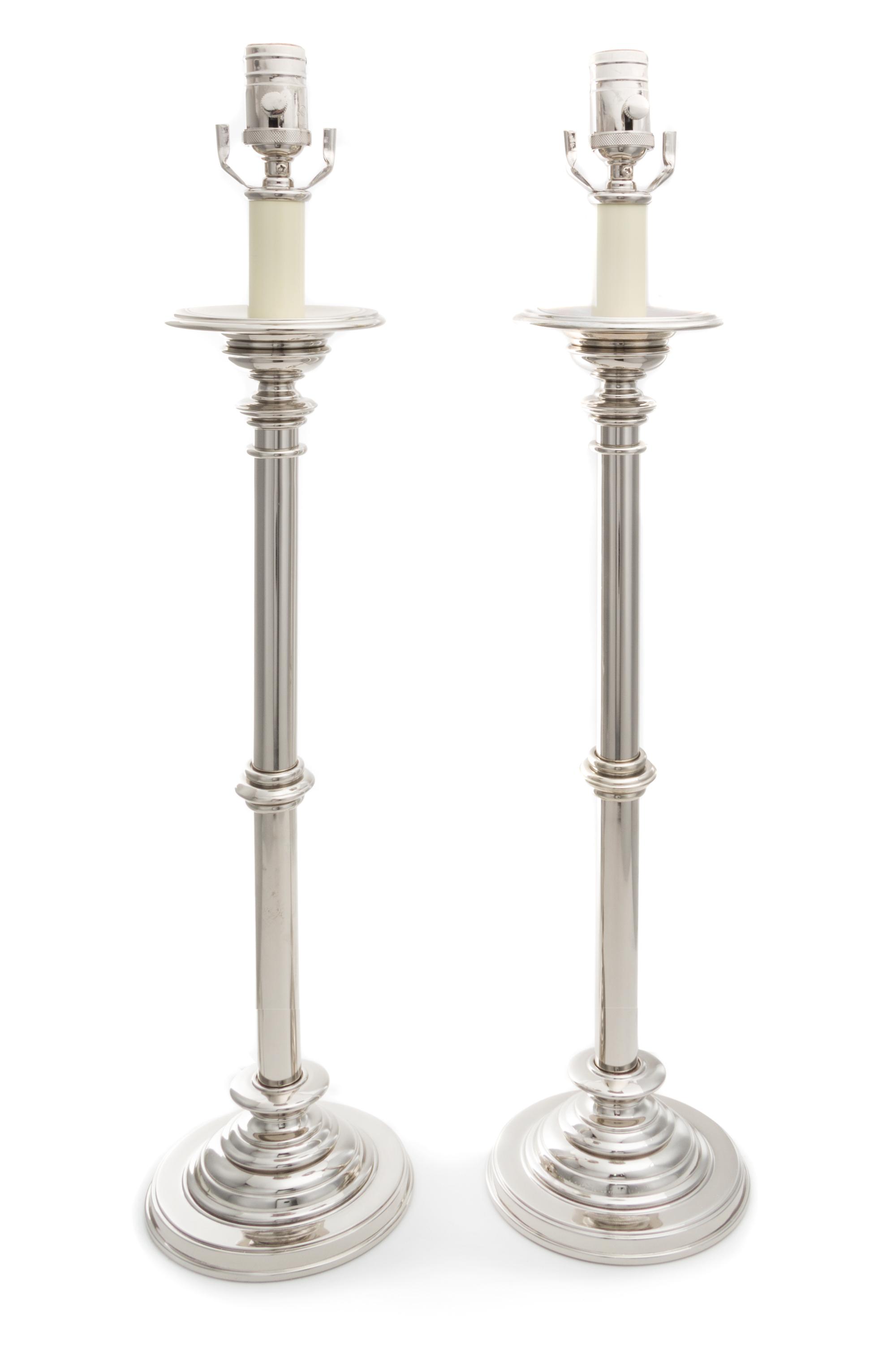 A Pair of Polished Metal Table Lamps Height 28 1/4 inches.