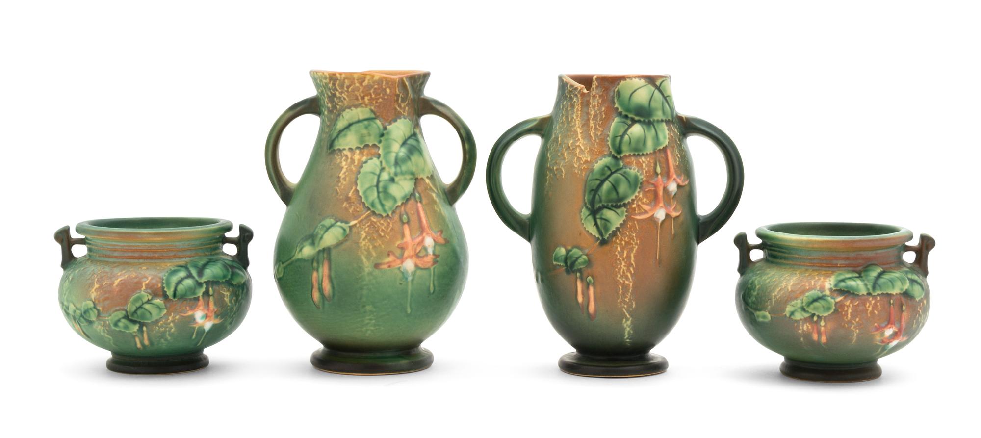 Four Roseville Freesia Pottery Vases Height of tallest 7 3/8 inches.