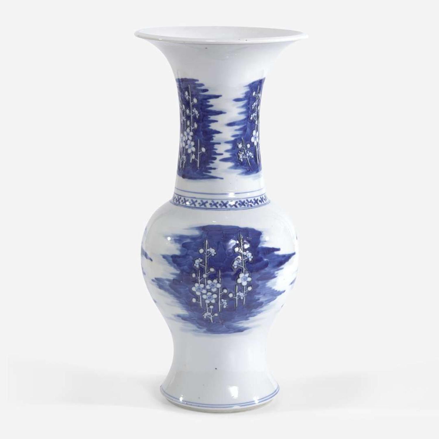 A Chinese blue and white carved "prunus" phoenix-tail vase 青花瓷雕梅花凤尾尊