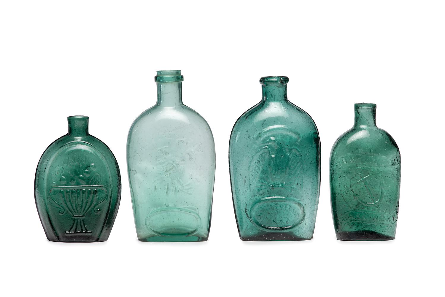Four Molded Glass Green Flasks