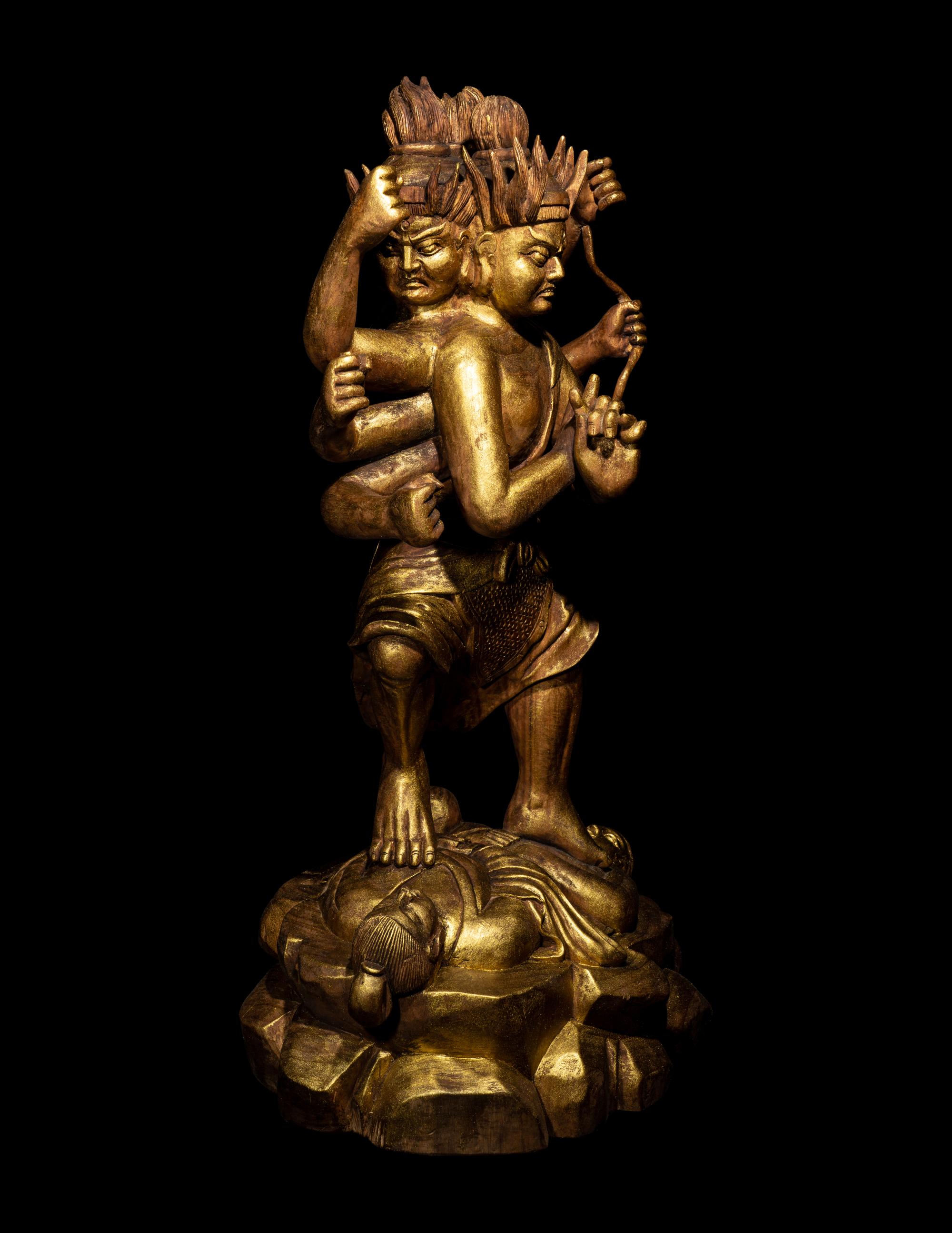 A Chinese Gilt Lacquered Wood Figure of a Deity
