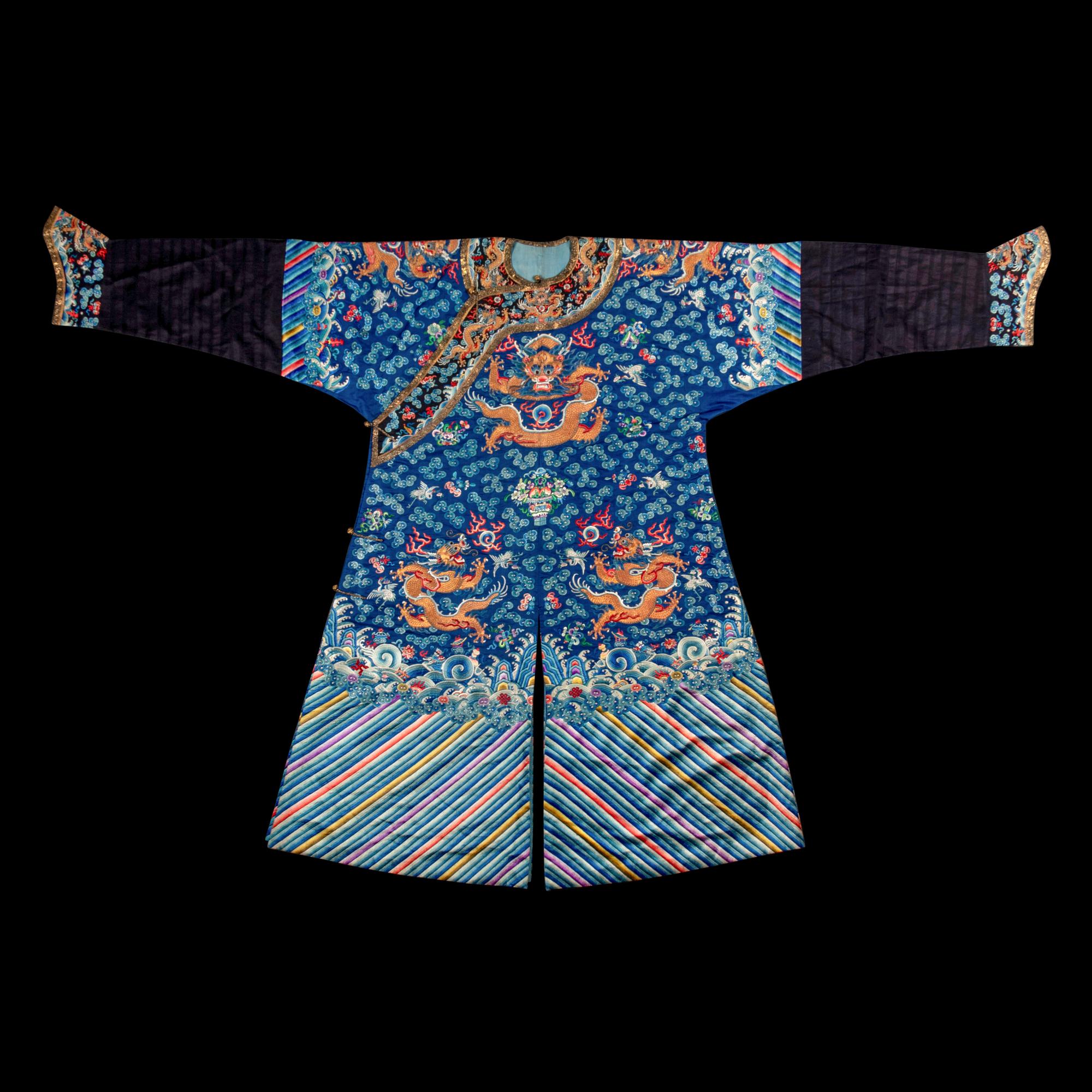 A Chinese Blue Ground Embroidered Silk Dragon Robe, Jifu, Late 19th Century 清晚期 藍緞地綉云龍紋吉服