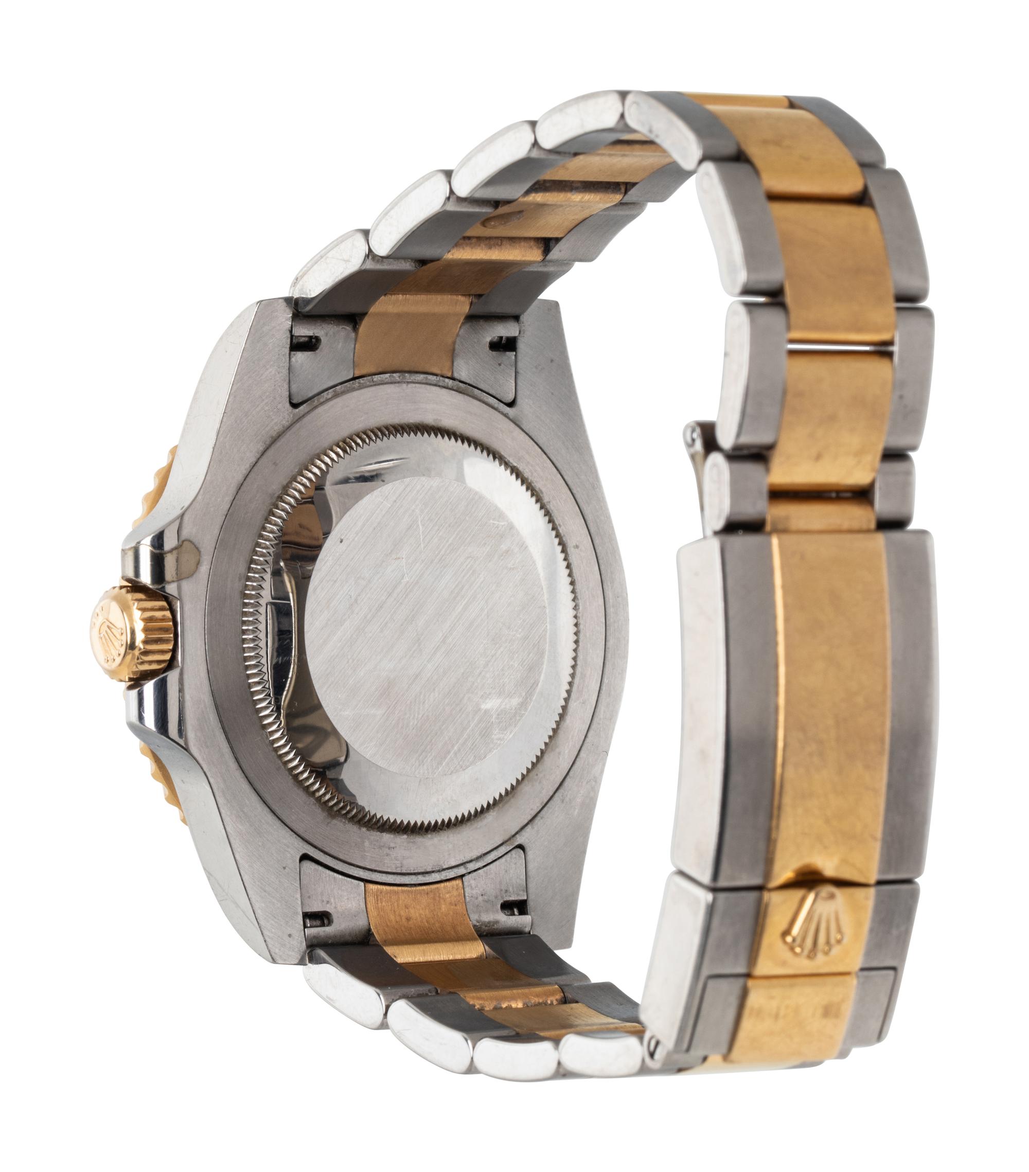 ROLEX, REF. 116713 STAINLESS STEEL AND YELLOW GOLD 'GMT-MASTER II' WATCH, BOX & PAPERS