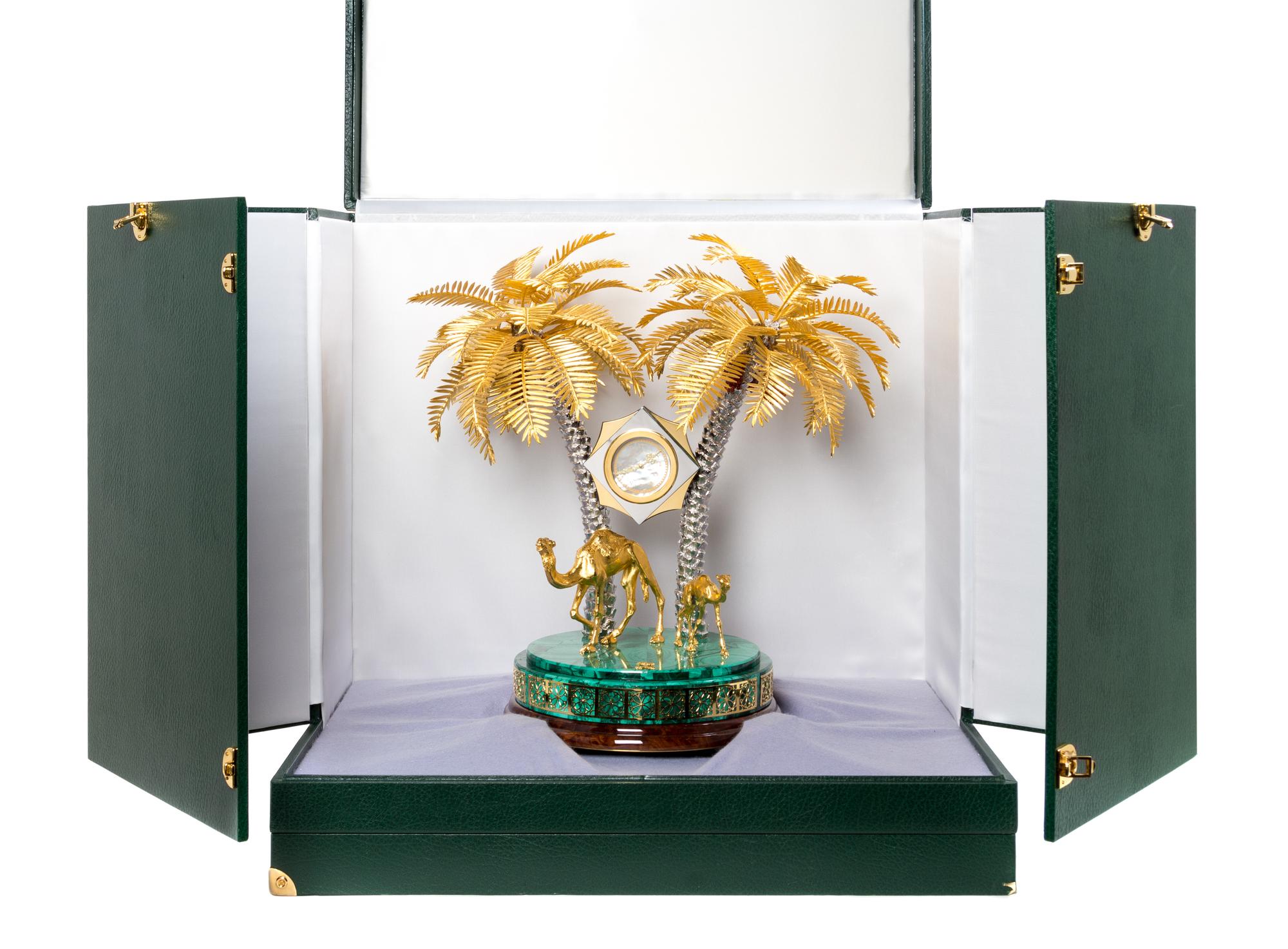 A Gilt Metal and Malachite Veneered Clock Height 18 1/2 inches. — MODERN