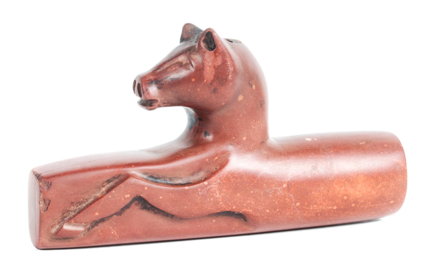 A Catlinite Effigy Pipe Length 6 inches.