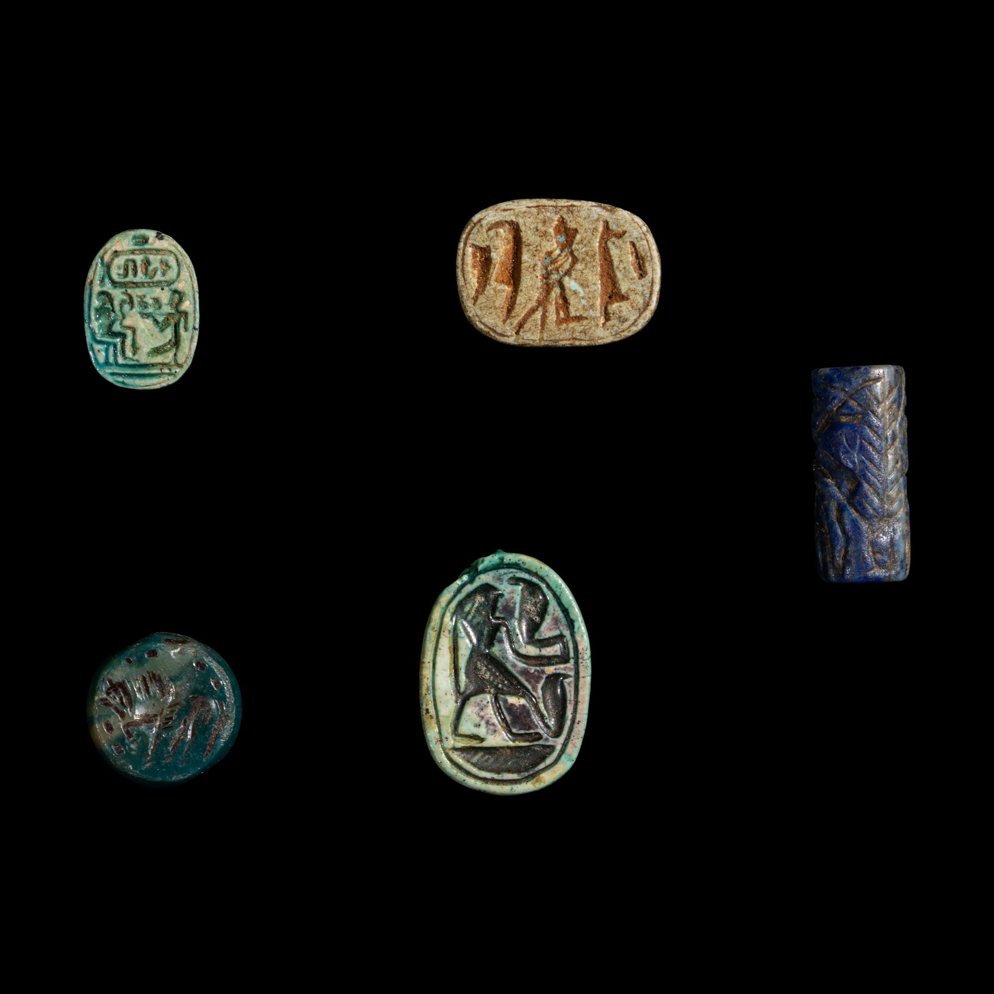 A Group of 3 Egyptian Faience Scarabs and 2 Near Eastern Stone Seals