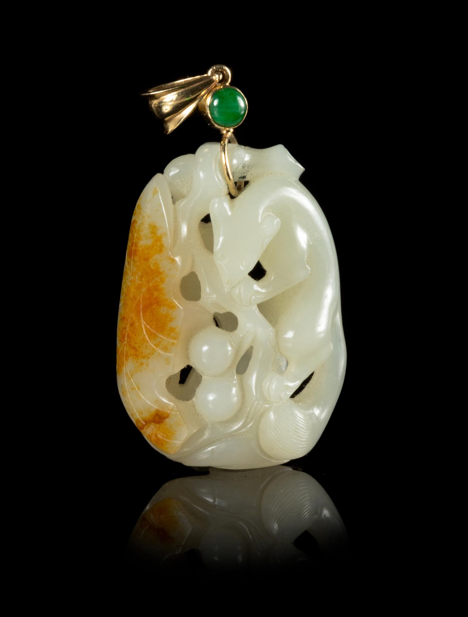 A Carved White and Russet Jade Pendant Length 2 inches. — 19TH CENTURY