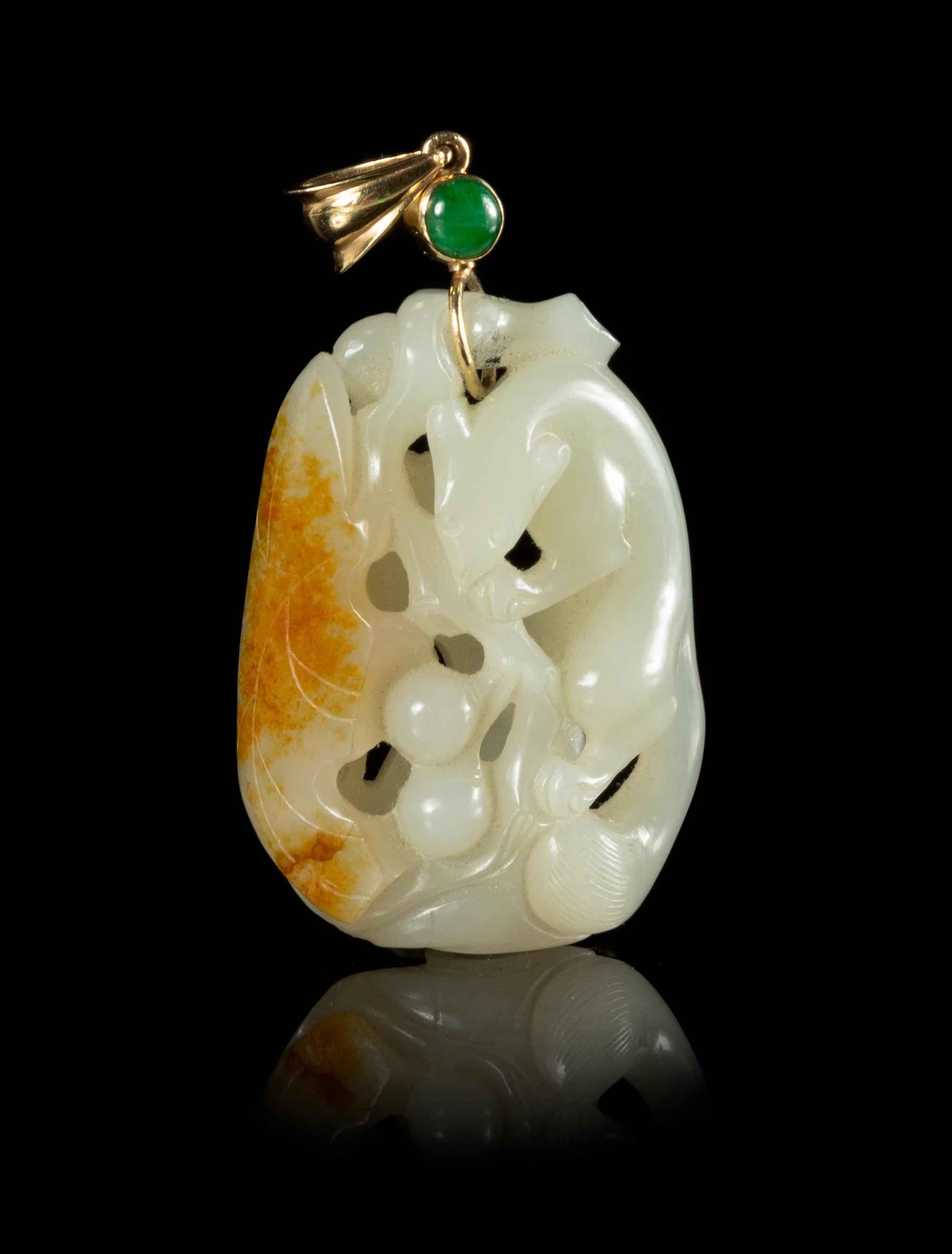 A Carved White and Russet Jade Pendant Length 2 inches. — 19TH CENTURY