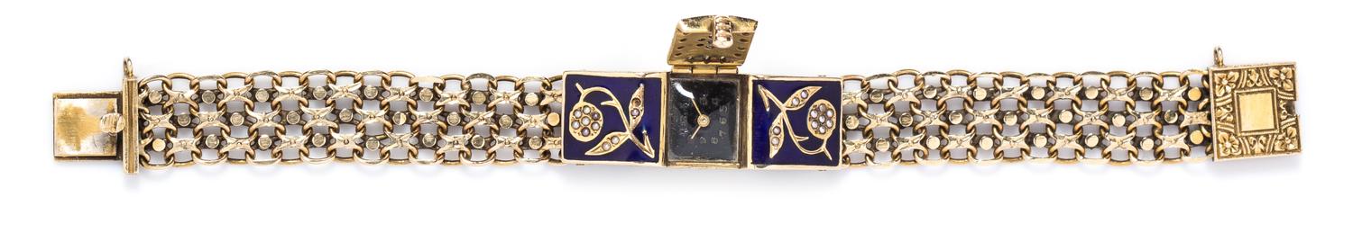 A 14 Karat Yellow Gold, Enamel and Seed Pearl Surprise Watch, 22.60 dwts.