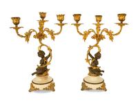 A Pair of Gilt and Patinated Bronze Figural Three-Light Candelabra