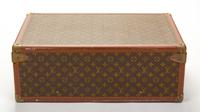 A Louis Vuitton Monogram Canvas Alzer Suitcase, 16" H x 23.5"W x 8.25"D; Handle drop: 2".