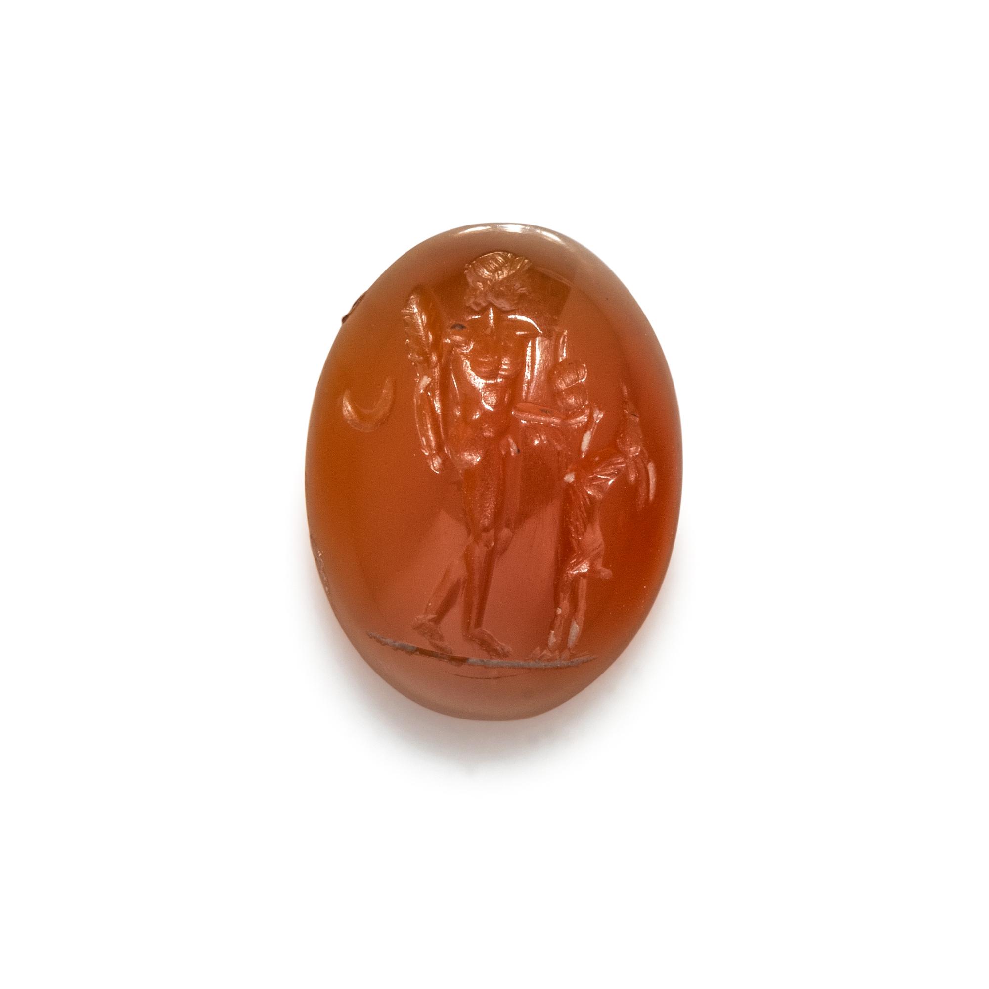 A Roman Carnelian Intaglio with the God Dionysus Teasing a Goat with Grapes