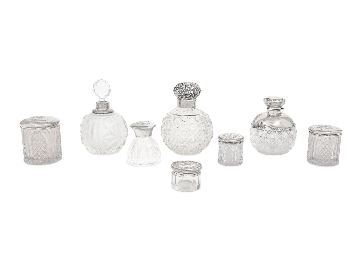 A Collection of Eight Silver Mounted Jars