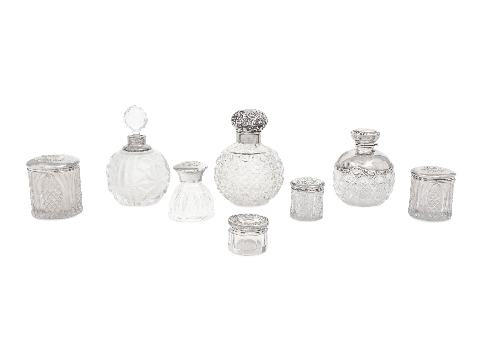 A Collection of Eight Silver Mounted Jars