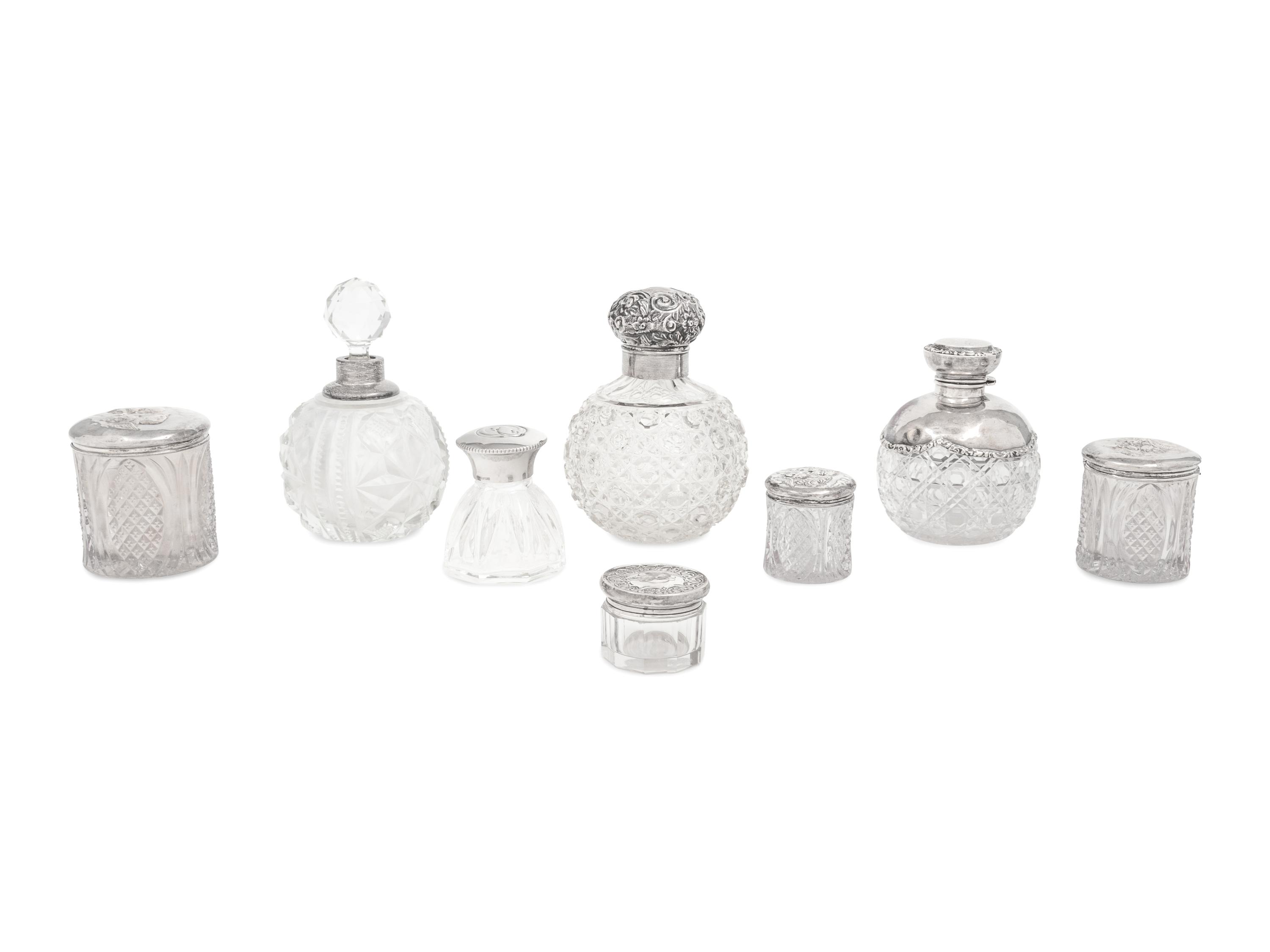 A Collection of Eight Silver Mounted Jars