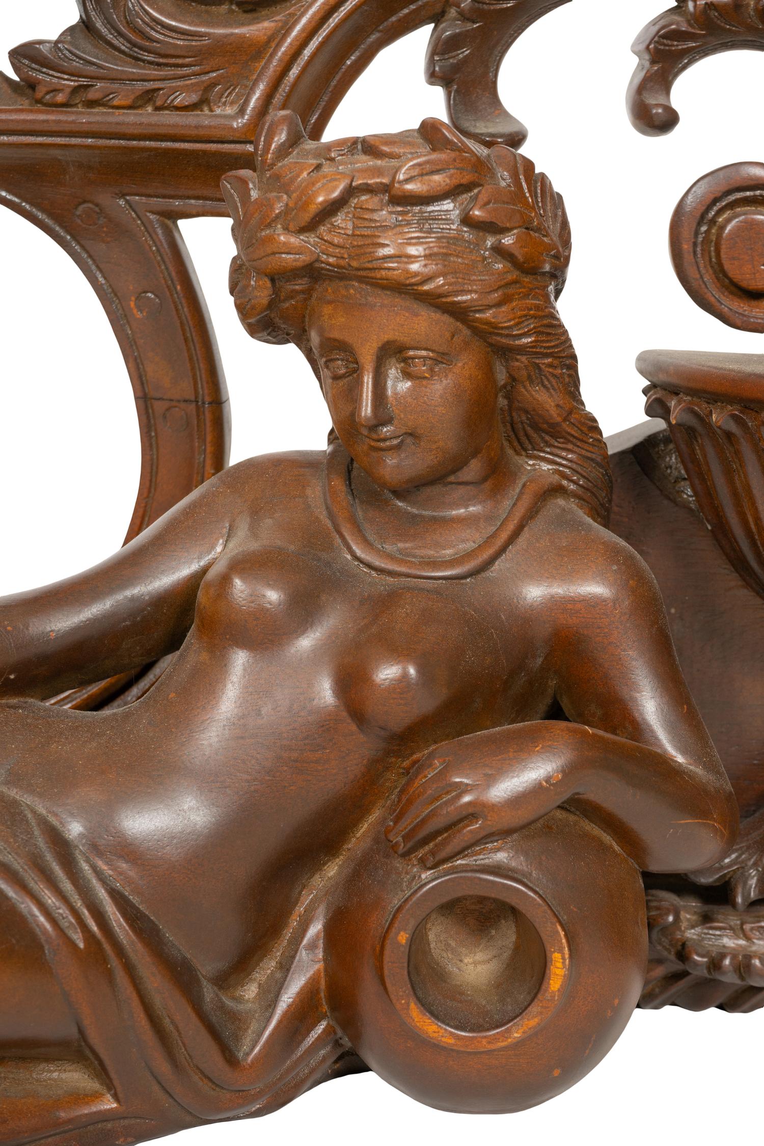 An Italian Renaissance Style Carved Mahogany Figural Transom