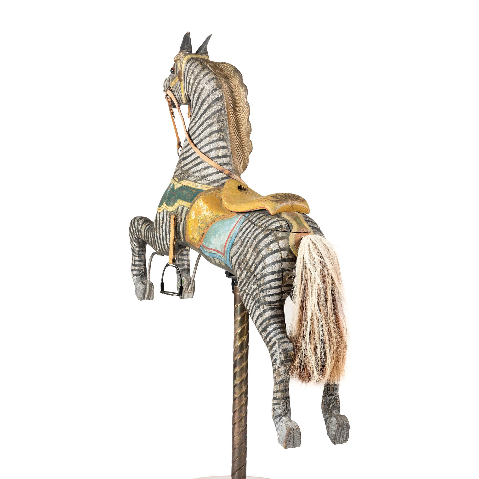 A Glass Inset Carved, Parcel-Gilt and Painted Wood Zebra Carousel Figure