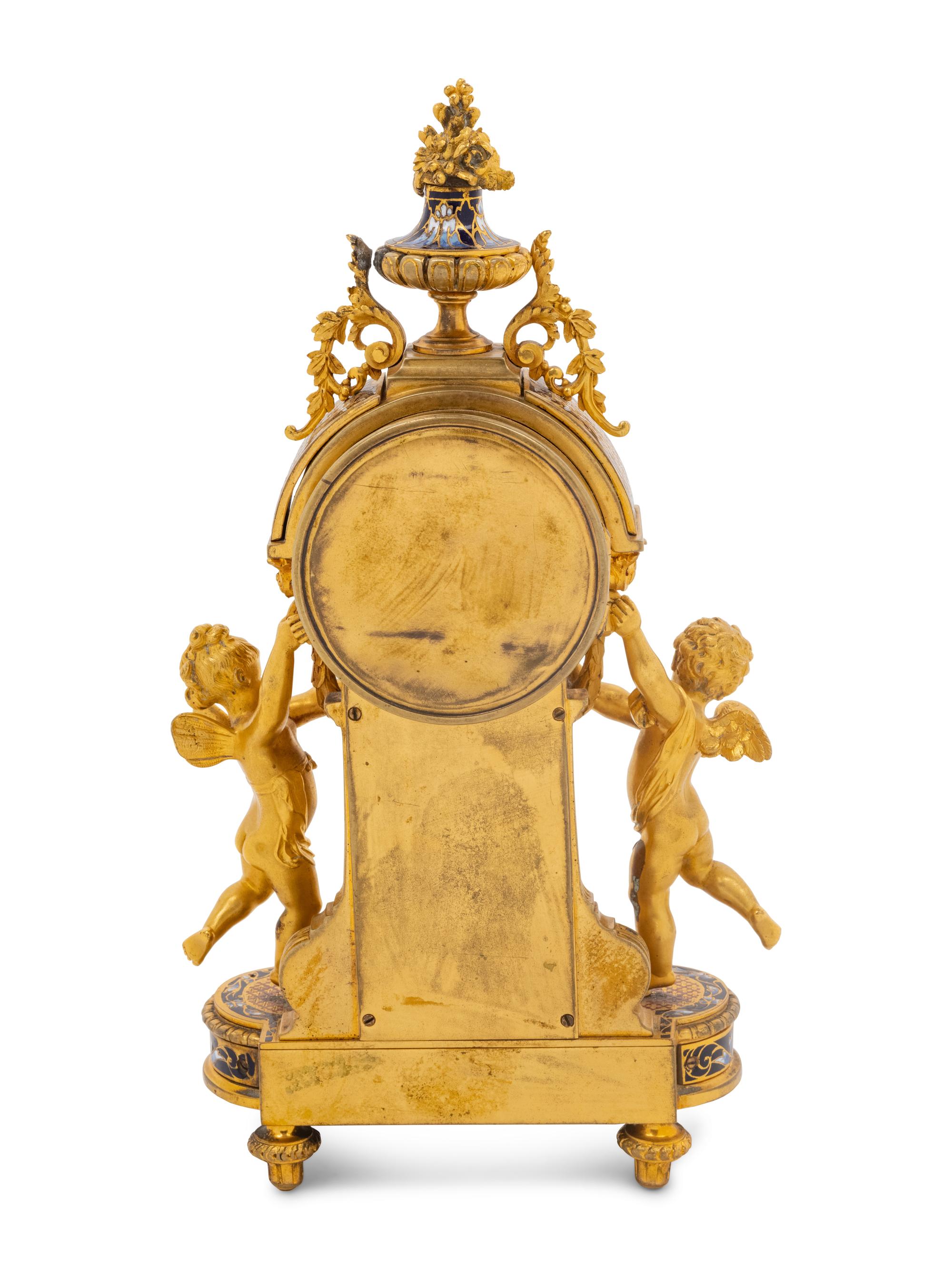 A French Gilt Bronze and Champlevé Figural Mantel Clock