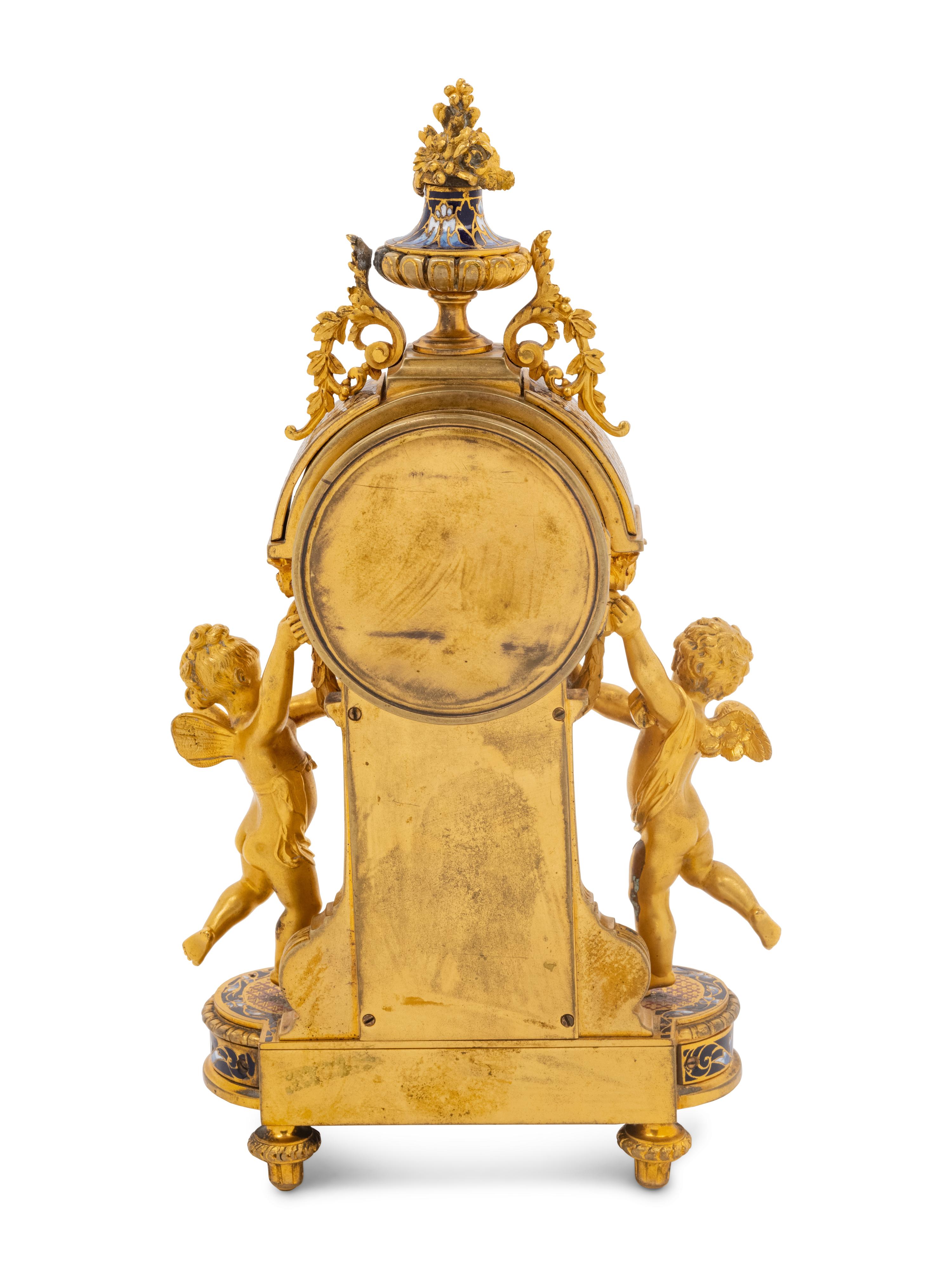 A French Gilt Bronze and Champlevé Figural Mantel Clock