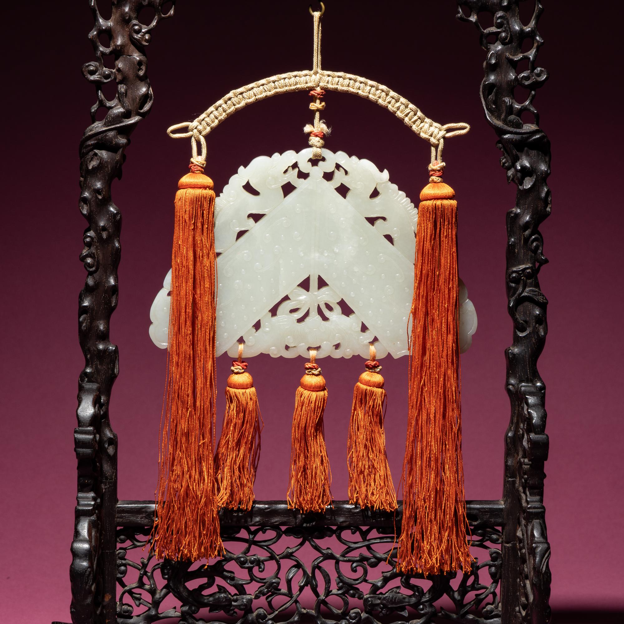 A Chinese White Jade Chime-Form Pendant, 18th/19th Century — 清中期 白玉罄