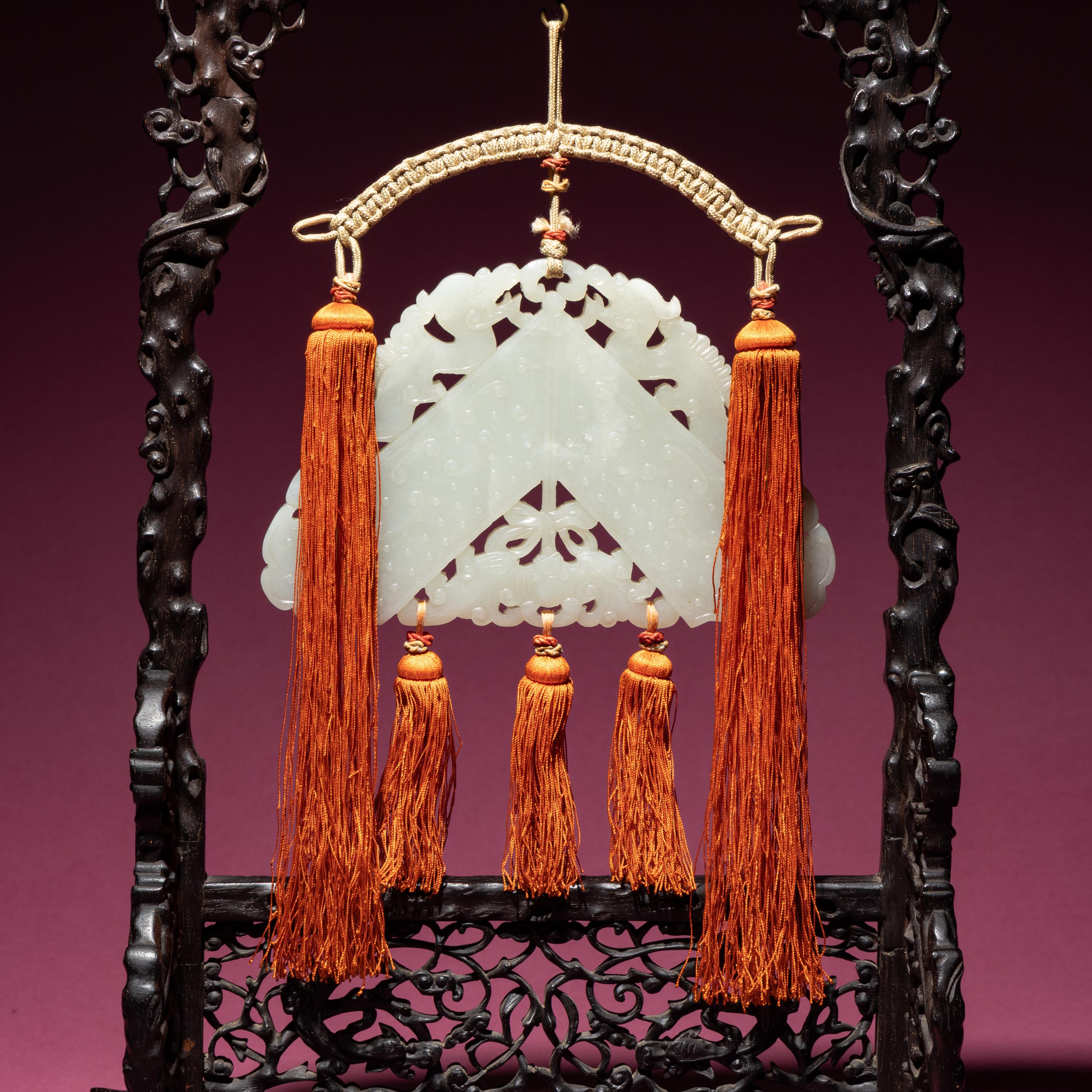 A Chinese White Jade Chime-Form Pendant, 18th/19th Century — 清中期 白玉罄