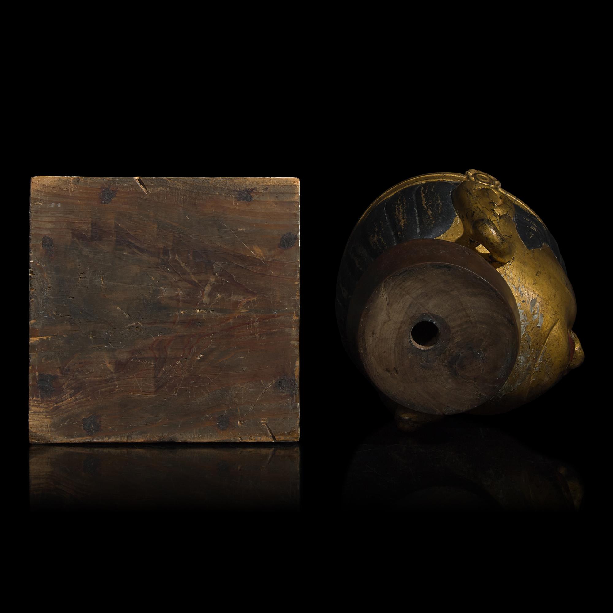 A Japanese Gilt and Black Painted Wood Head of a Bosatsu
