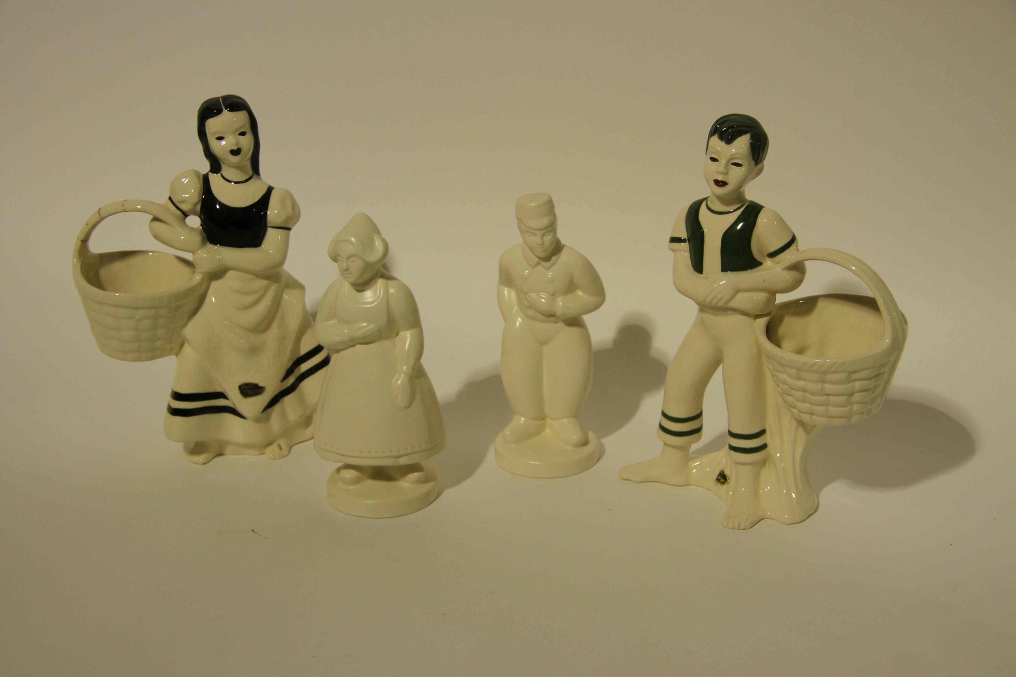 A Group of Eight Haeger Pottery Figural Vases Height of tallest 11 1/2 inches.