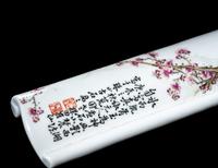 A Famille Rose Porcelain Scroll-Form Wrist Rest