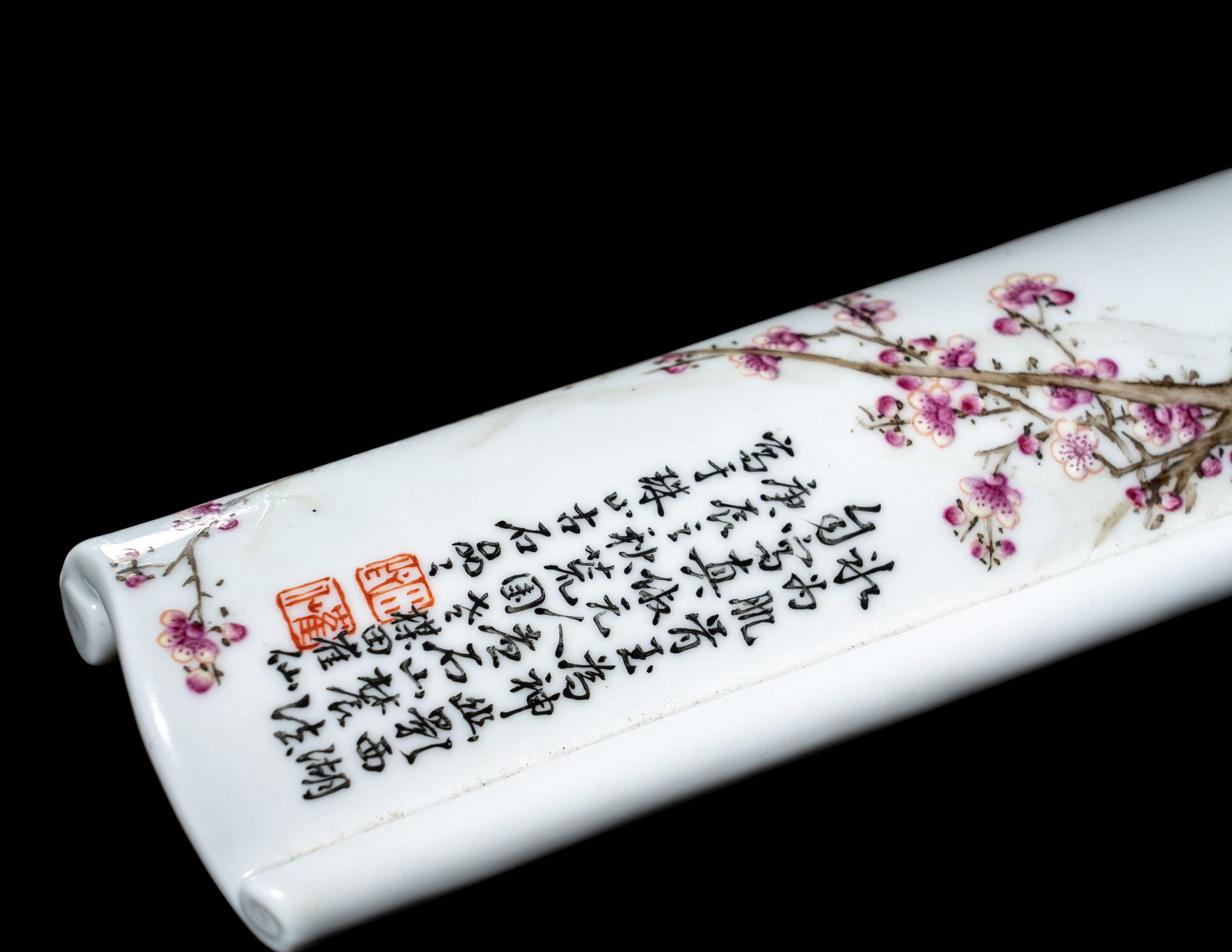 A Famille Rose Porcelain Scroll-Form Wrist Rest