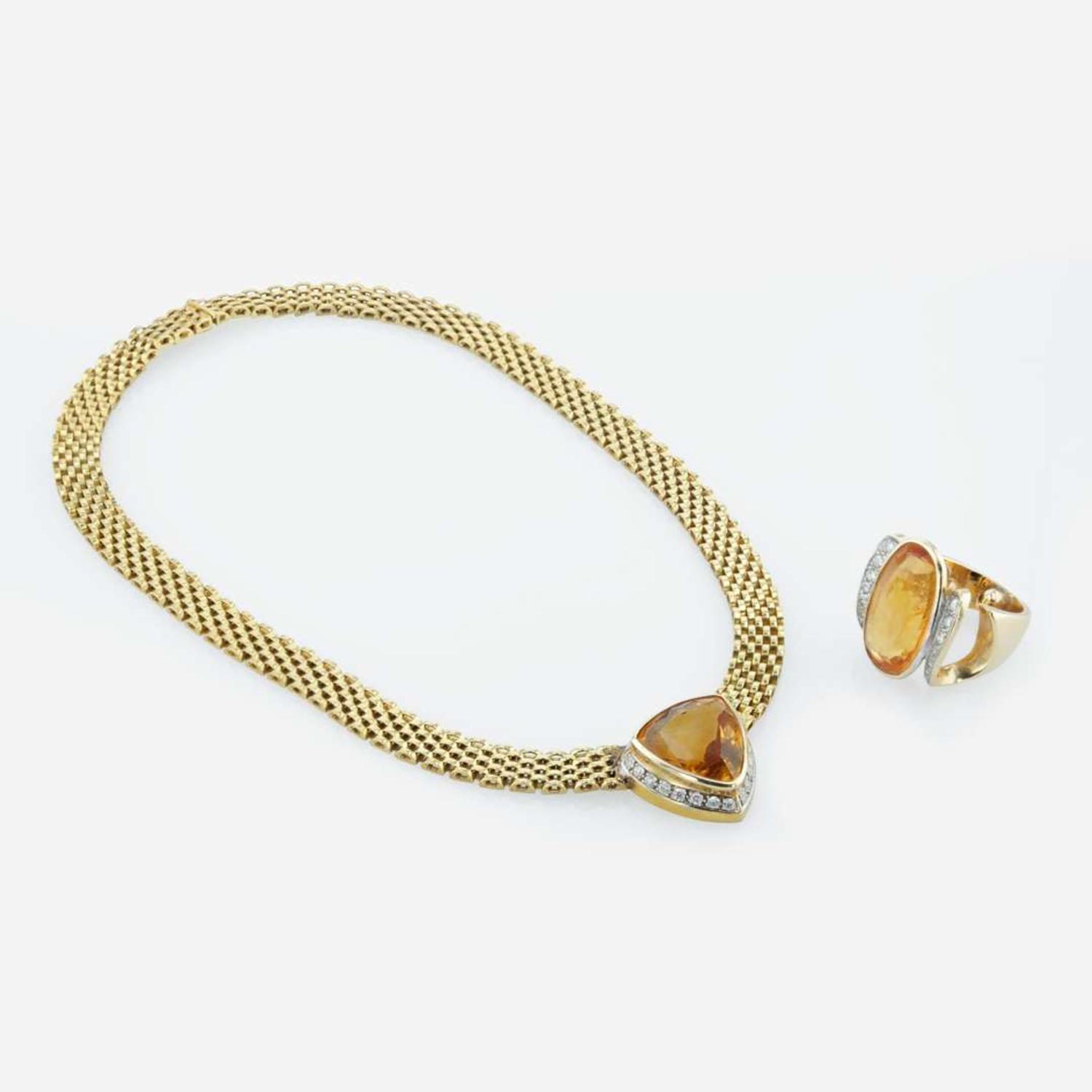 An 18K yellow gold and citrine necklace and topaz ring
