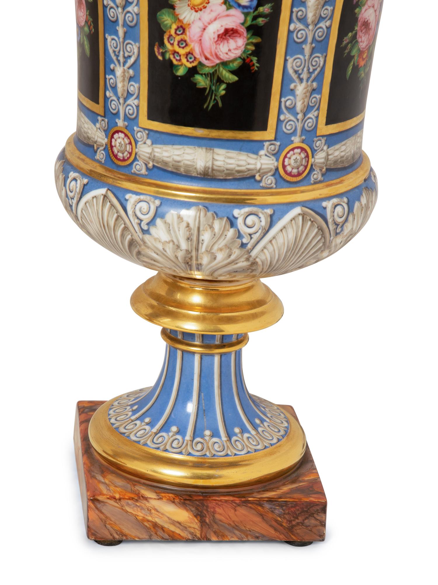 A Pair of Continental Parcel-Gilt and Polychrome Painted Porcelain Urns