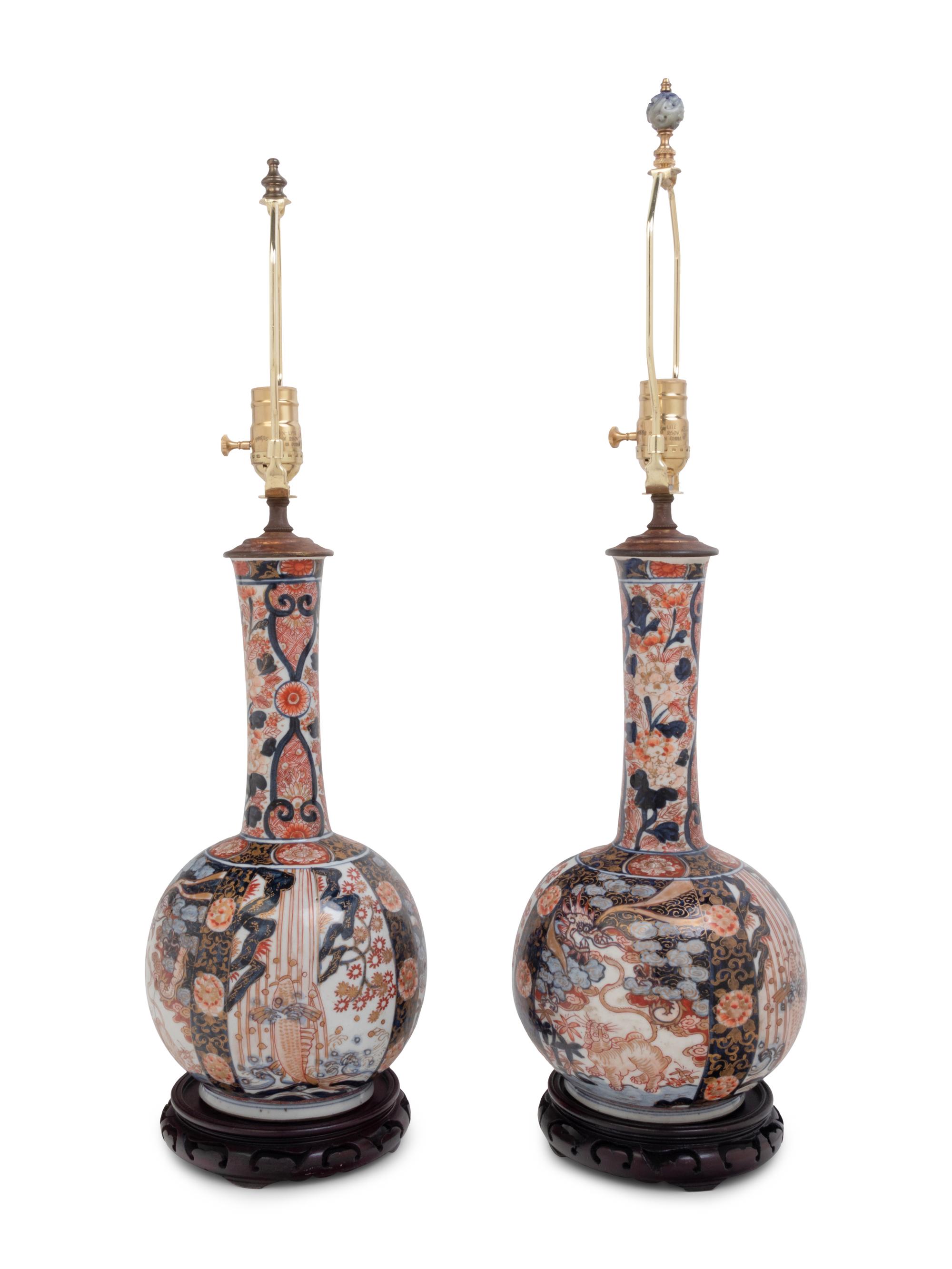 A Pair of Imari Palette Porcelain Bottle Vases Mounted as Lamps