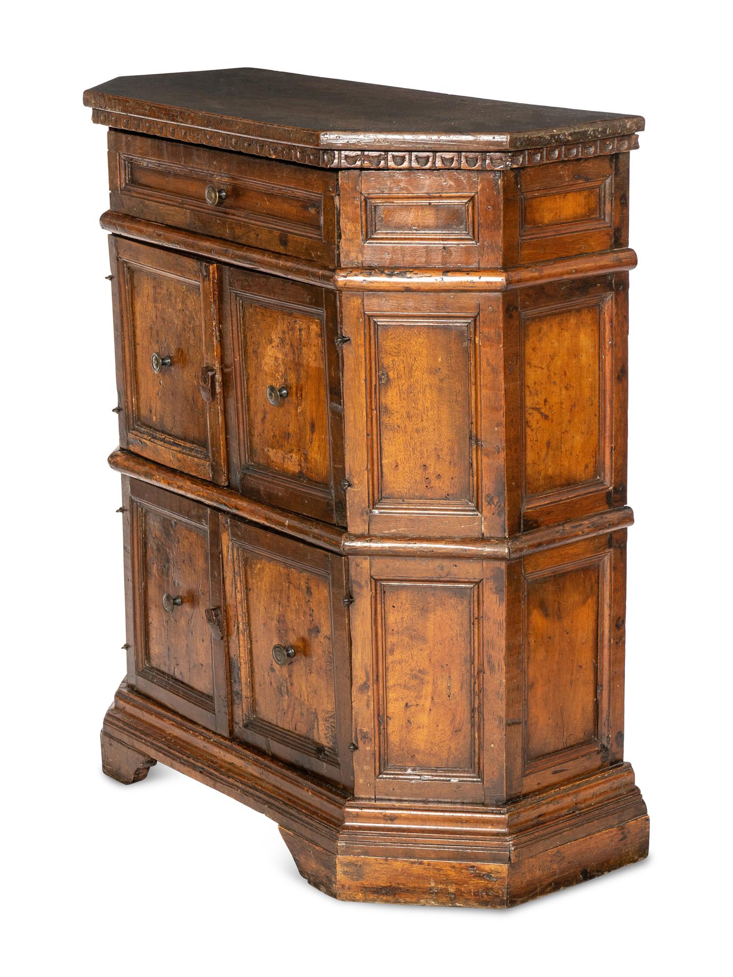 An Italian Baroque Carved Walnut Cabinet