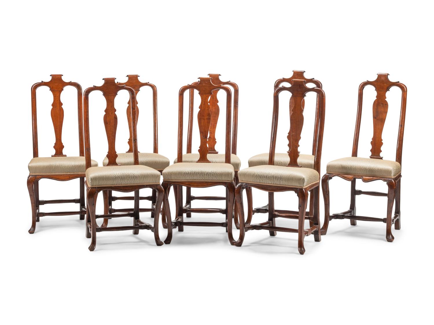 A Set of Eight Dutch Rococo Walnut Dining Chairs