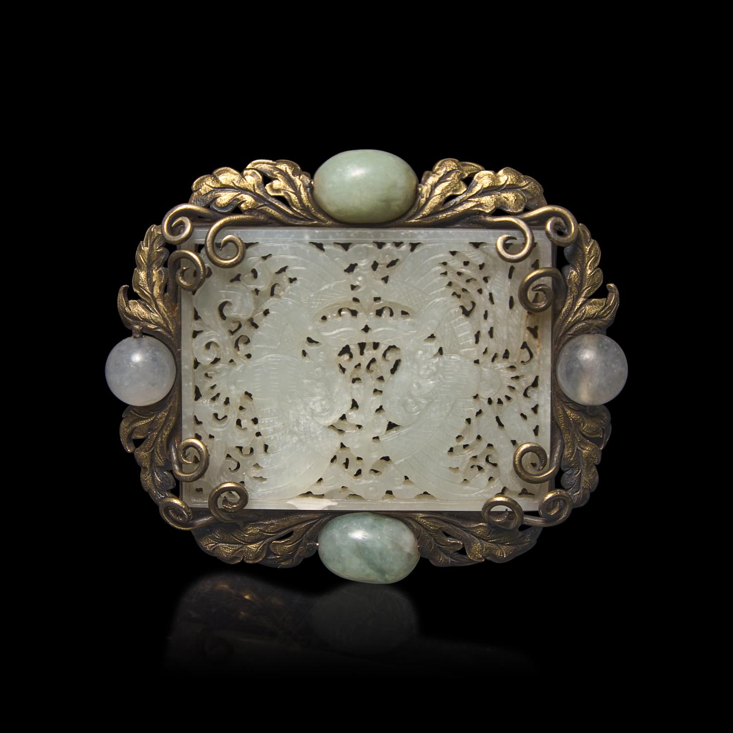 A Chinese White Jade 'Double Phoenix' Belt Plaque, Ming Dynasty 明 白玉鏤雕雙鳳紋帶板