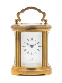 A Swiss Gilt Brass Carriage Clock Height 4 inches. — MATTHEW NORMAN, 20TH CENTURY