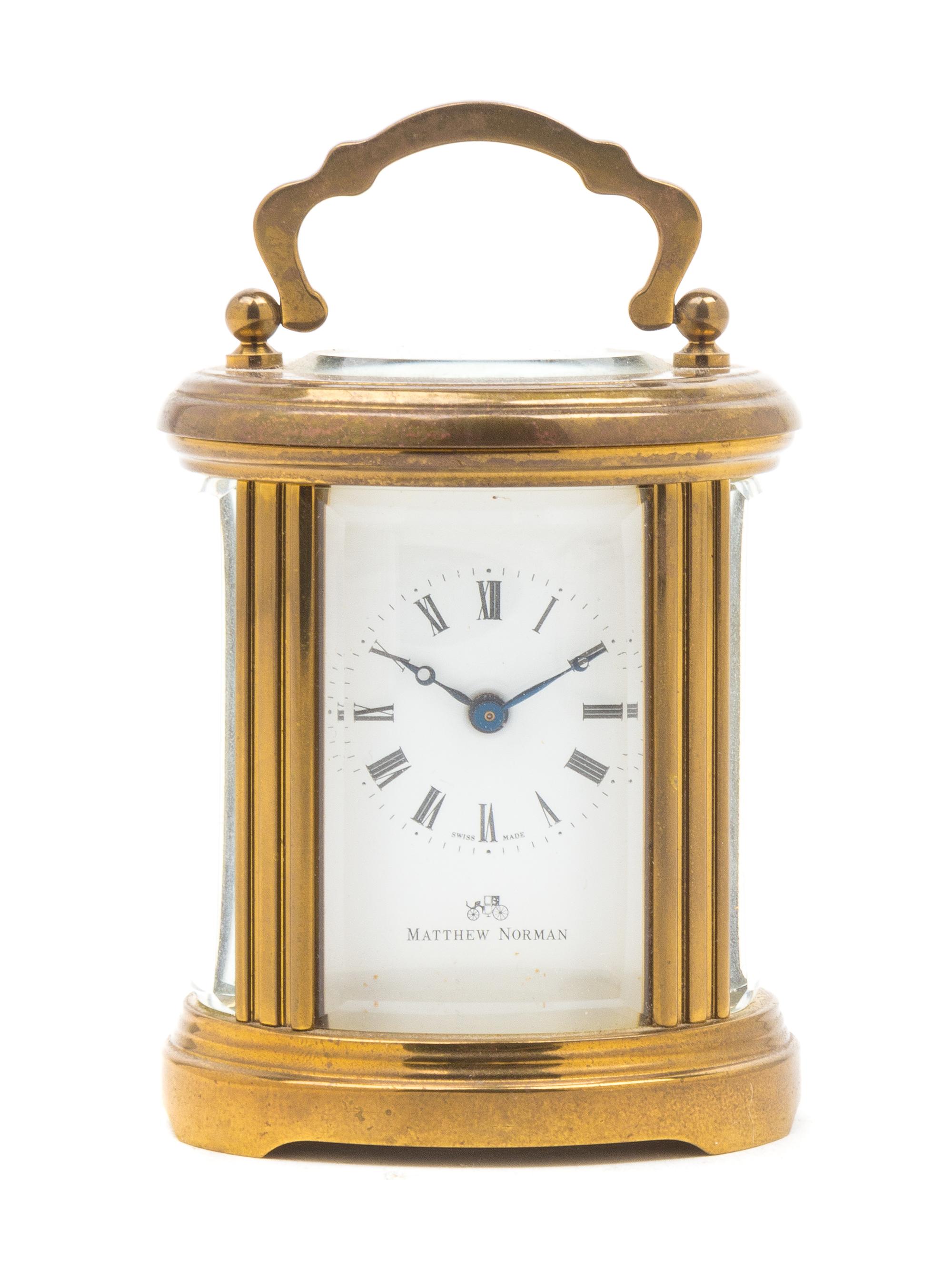 A Swiss Gilt Brass Carriage Clock Height 4 inches. — MATTHEW NORMAN, 20TH CENTURY