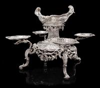 A George II Silver Epergne, Peter Archambo II & Peter Meure, London, 1753, the central basket of oval form with twin-foliate handles an