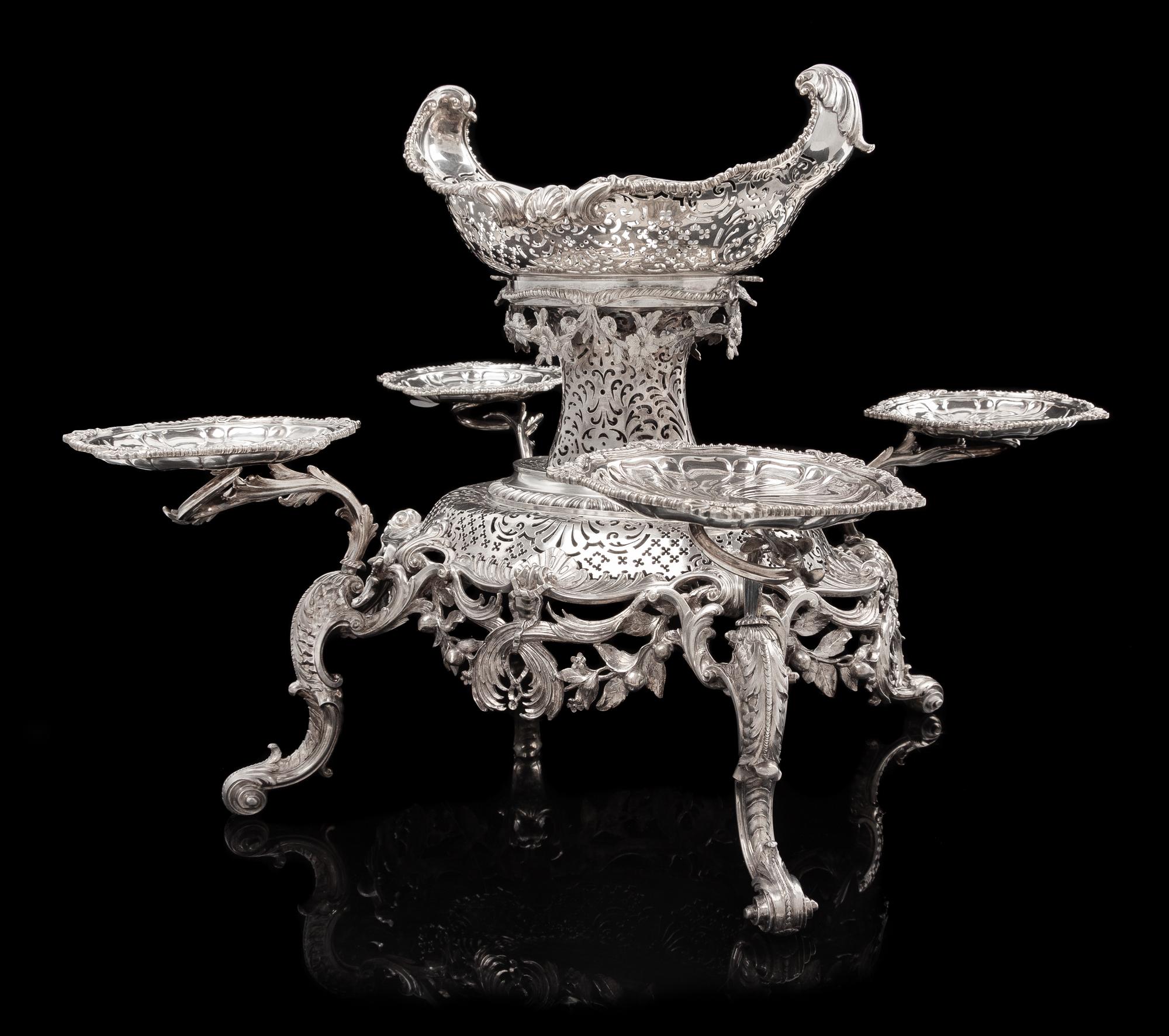 A George II Silver Epergne, Peter Archambo II & Peter Meure, London, 1753, the central basket of oval form with twin-foliate handles an
