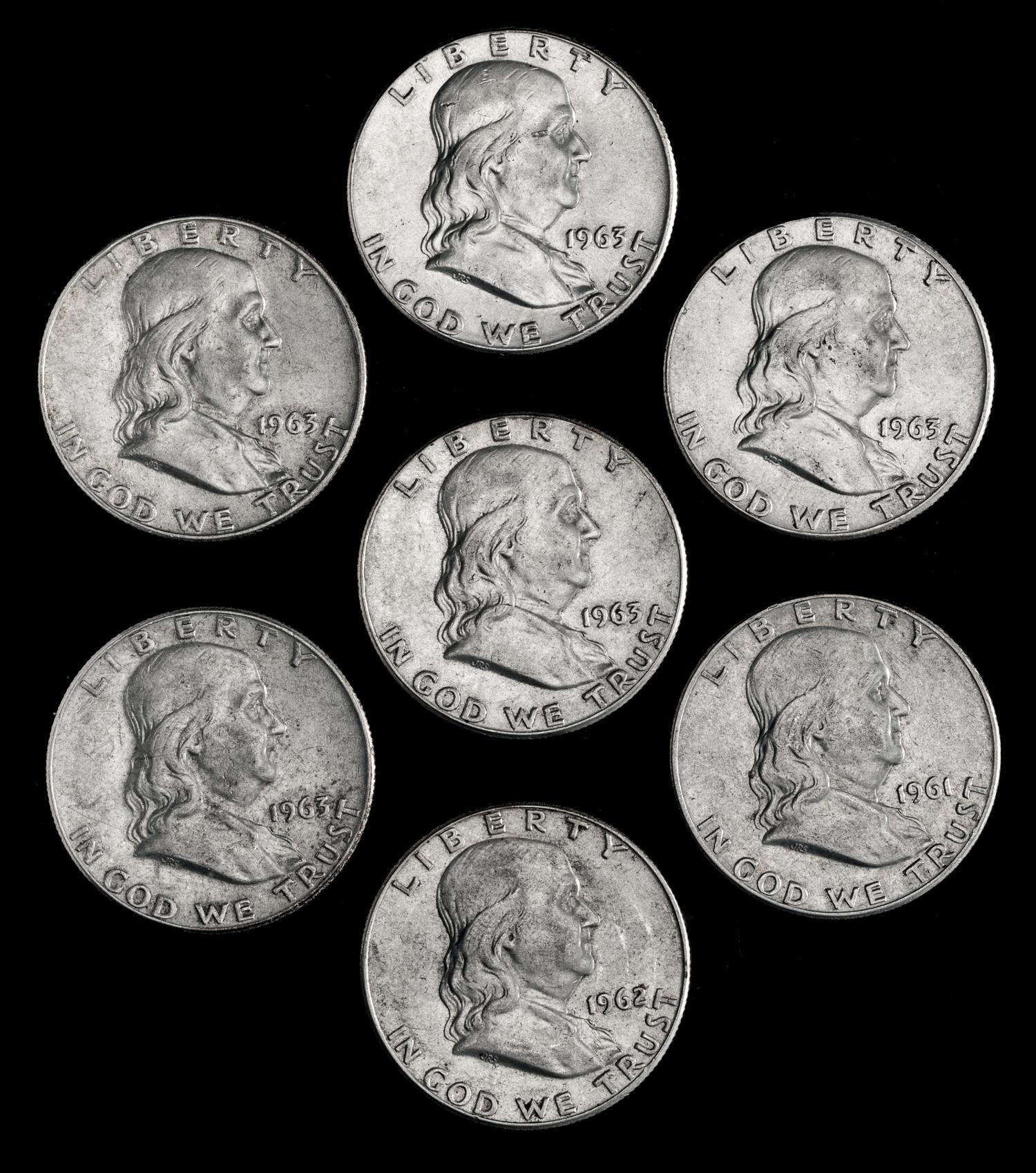 A Collection of Seven United States Benjamin Franklin 50C Coins