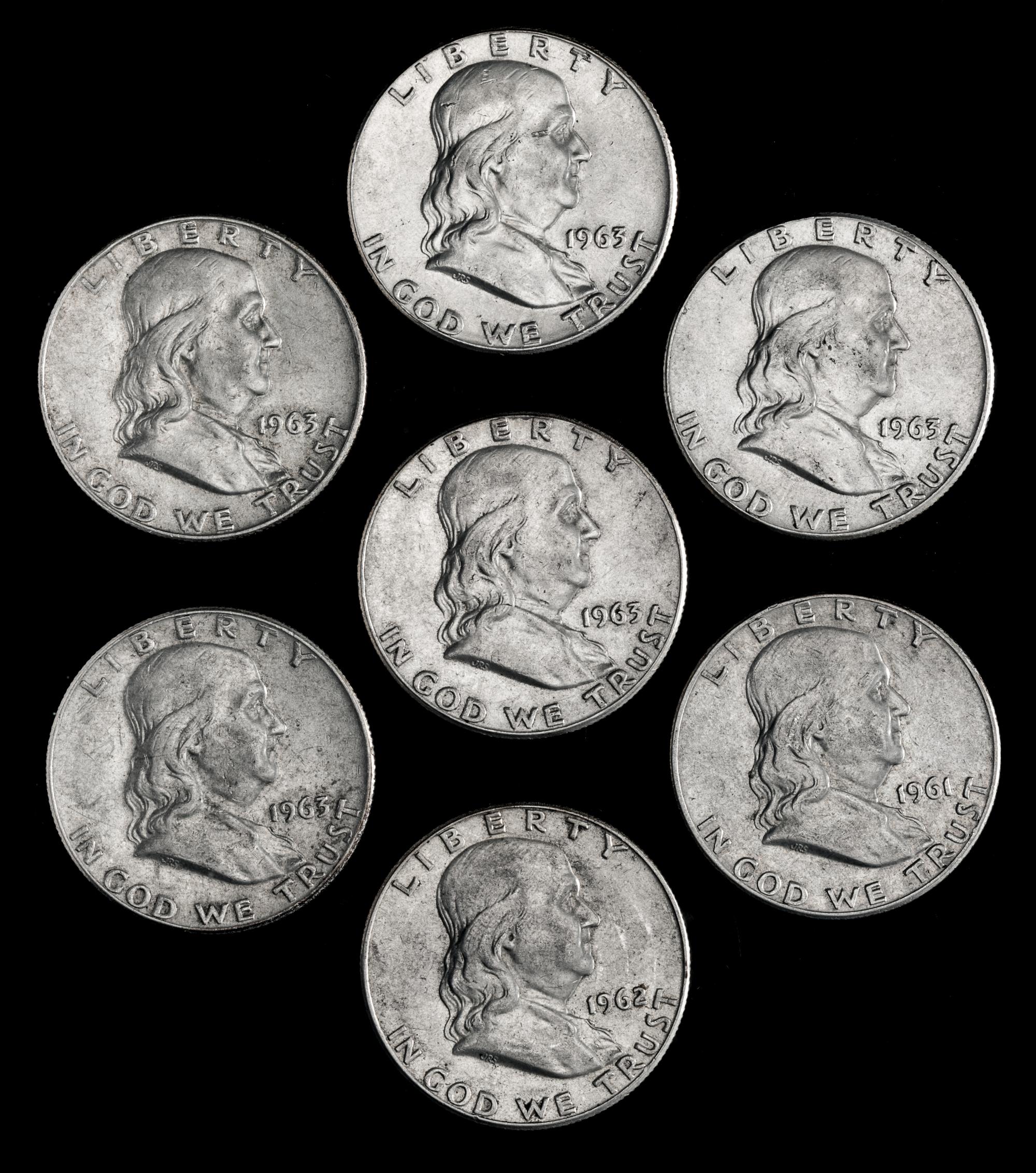 A Collection of Seven United States Benjamin Franklin 50C Coins