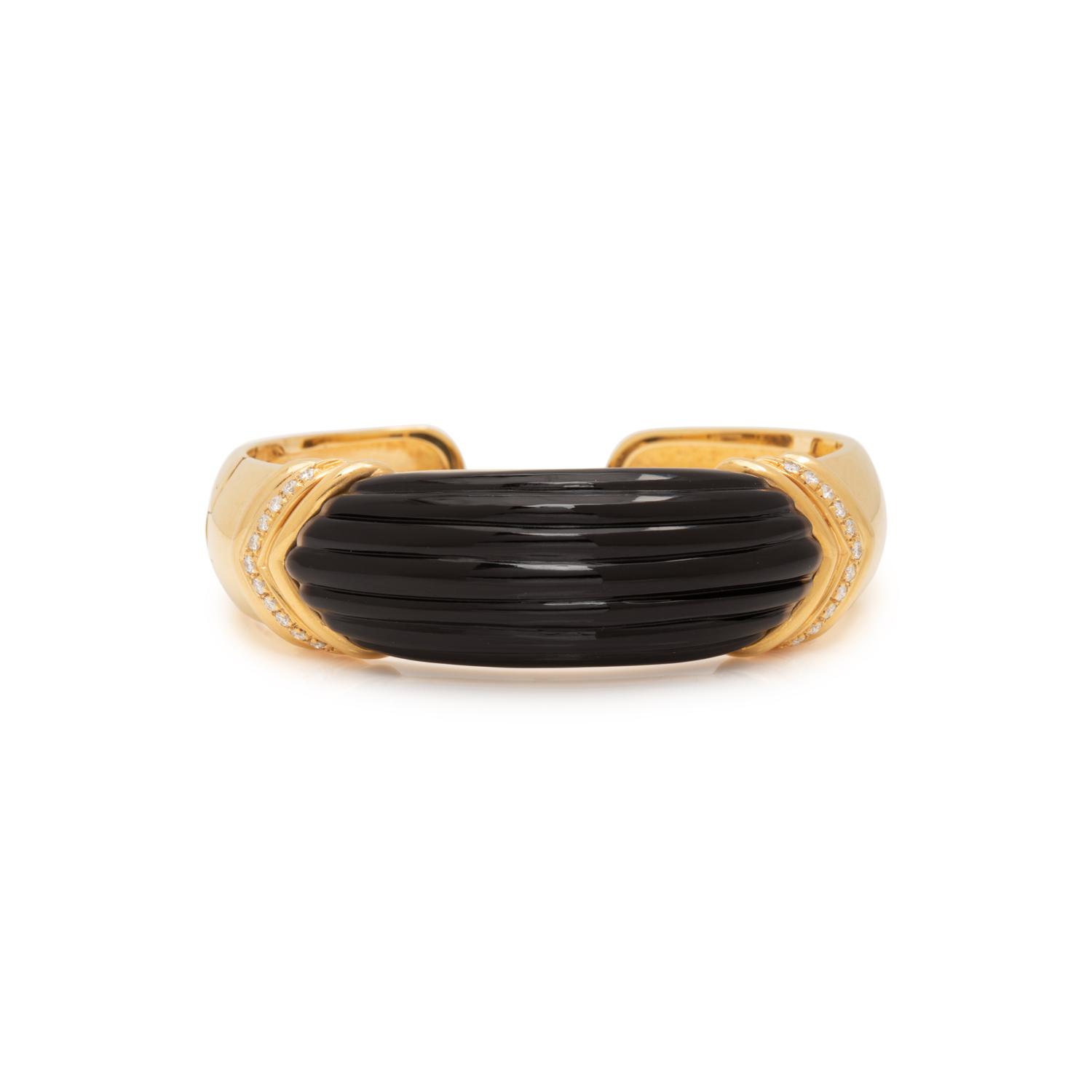 YELLOW GOLD, ONYX AND DIAMOND CUFF BRACELET