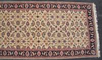 A Persian Style Wool Rug 14 feet 1 inch x 6 feet 10 inches. — SECOND HALF 20TH CENTURY