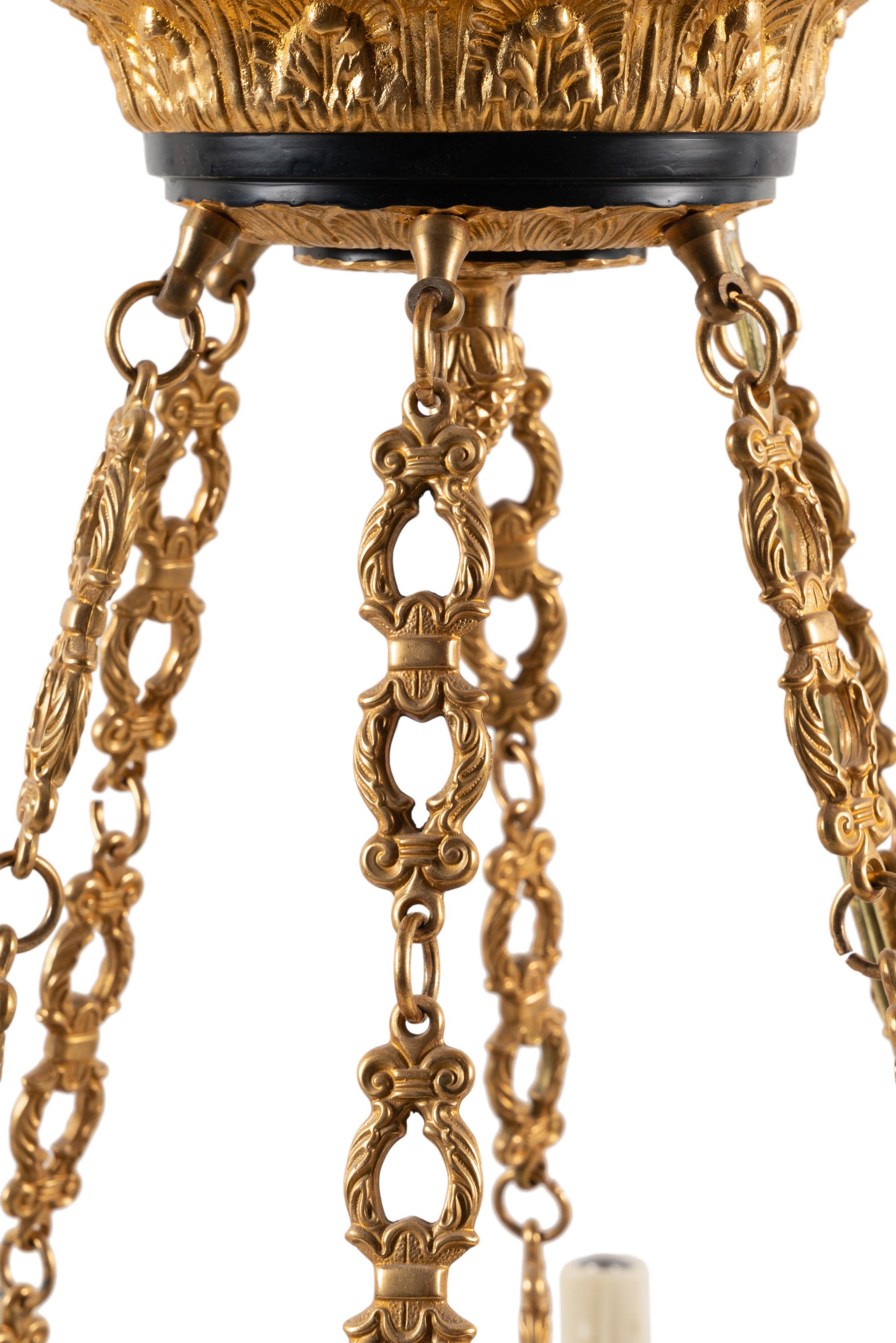 An Empire Style Gilt Bronze Twelve-Light Chandelier