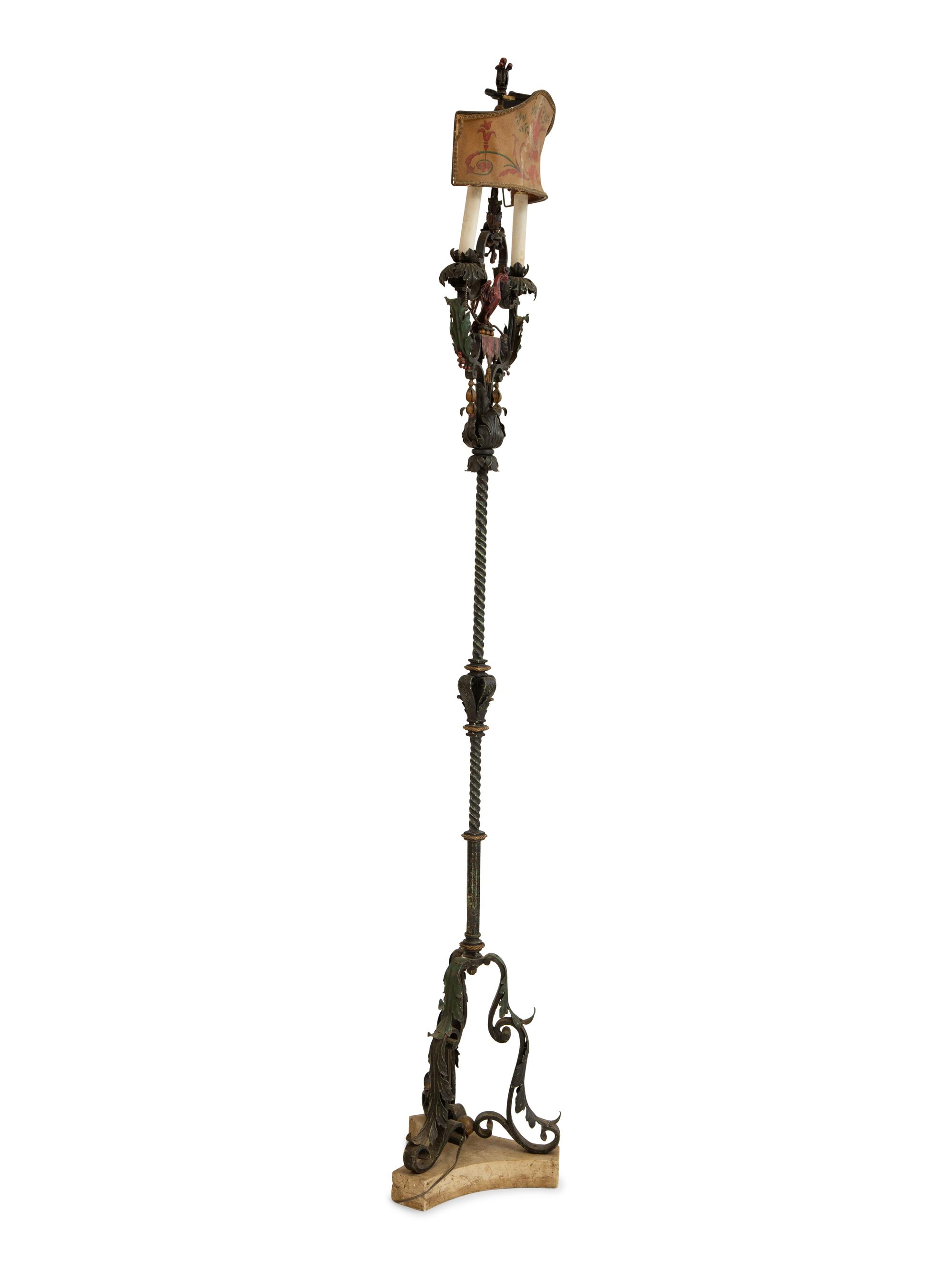 A Mizner Style Painted and Parcel Gilt Wrought Iron Four-Light Torchère with Polychromed Leather Shade